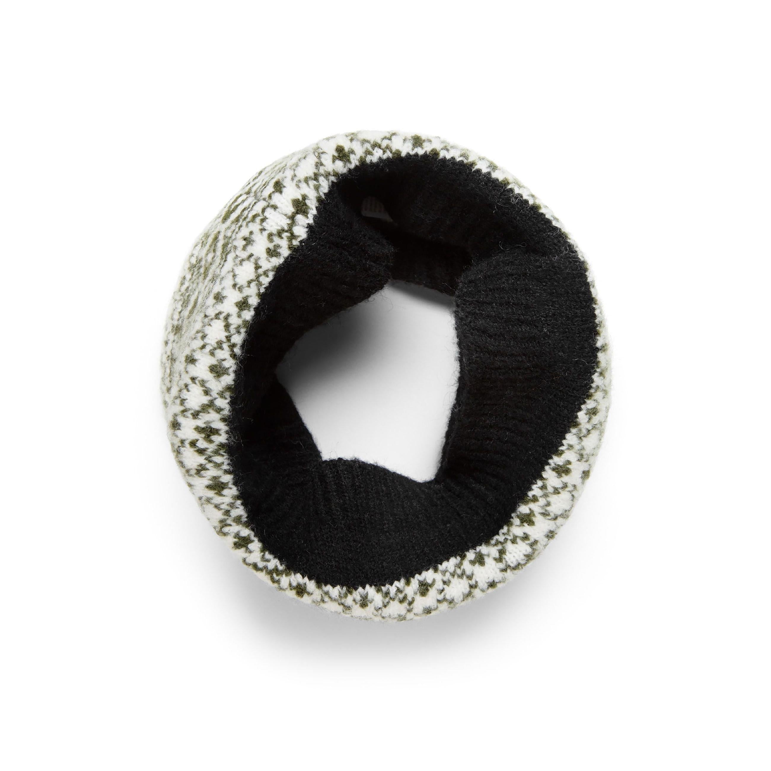 Snood shown in circular tube shape displaying the fair isle knit pattern with black interior lining visible