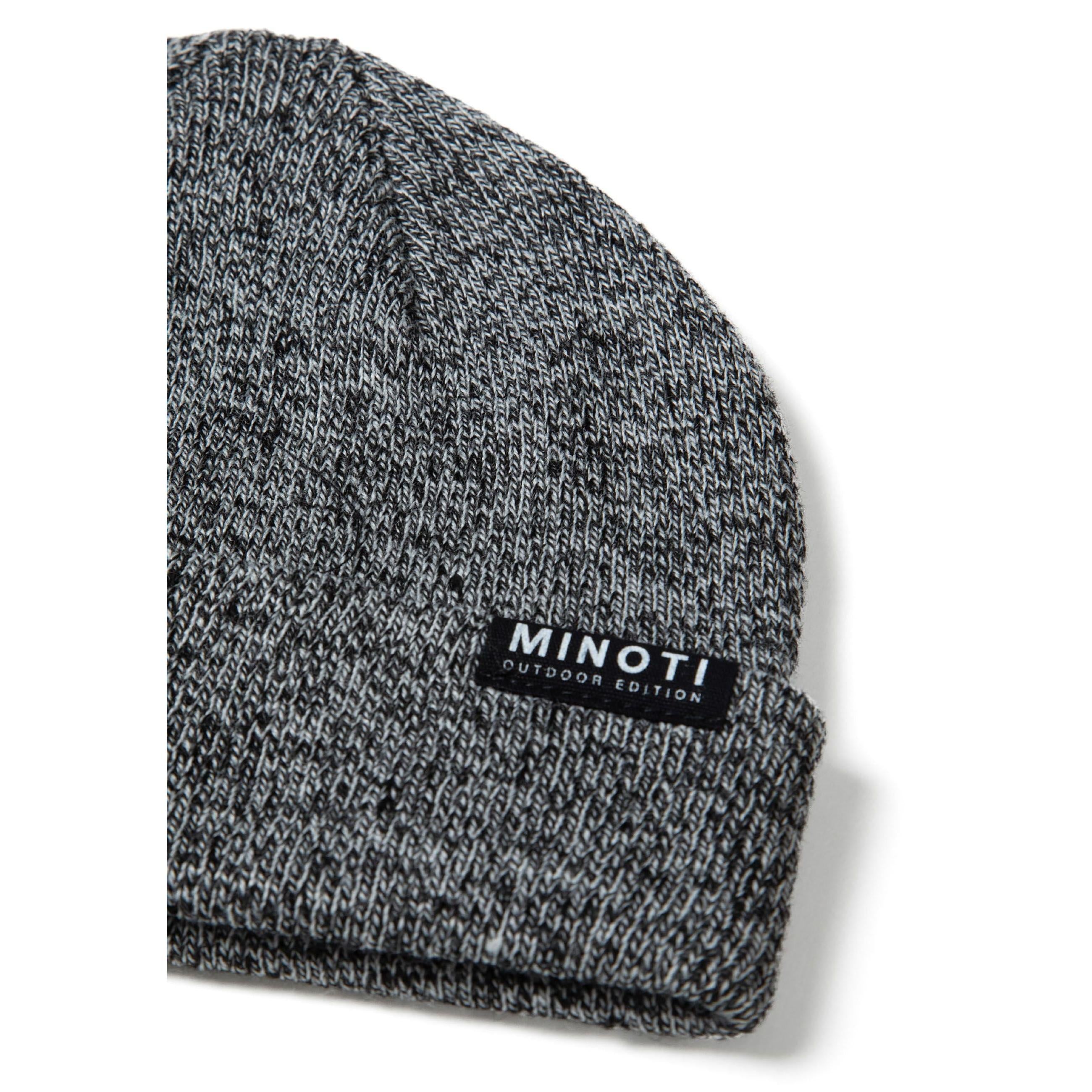 Close-up detail of grey knitted beanie showing ribbed cuff and black Minoti Outdoor Edition label