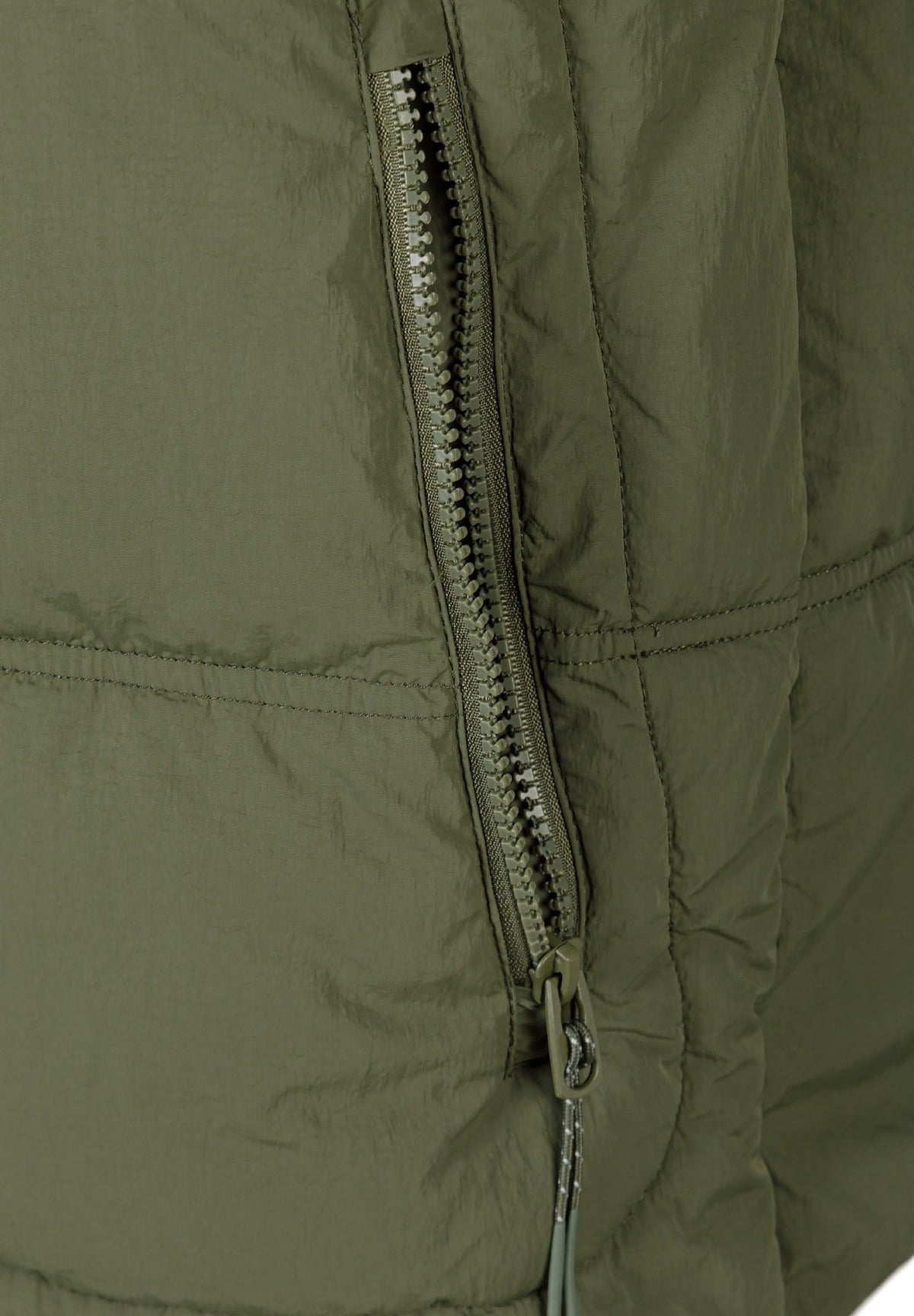 Close-up of the zip on the khaki puffer jacket.
