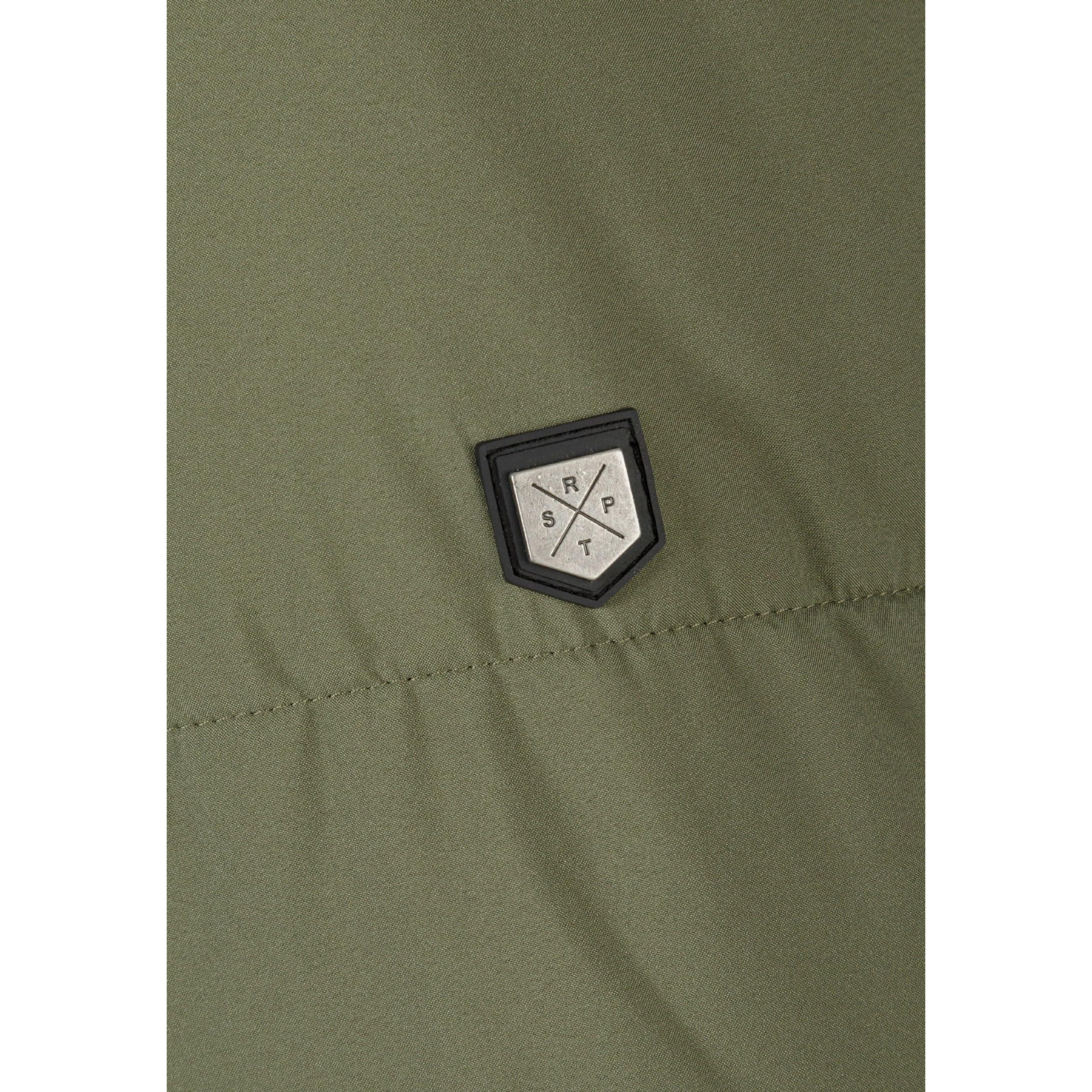 Close-up detail of khaki fabric texture showing brand patch with geometric logo design on quilted puffer jacket material