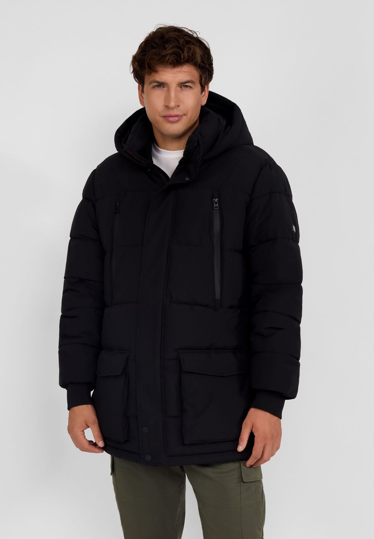 Men's black padded parka, shown worn.