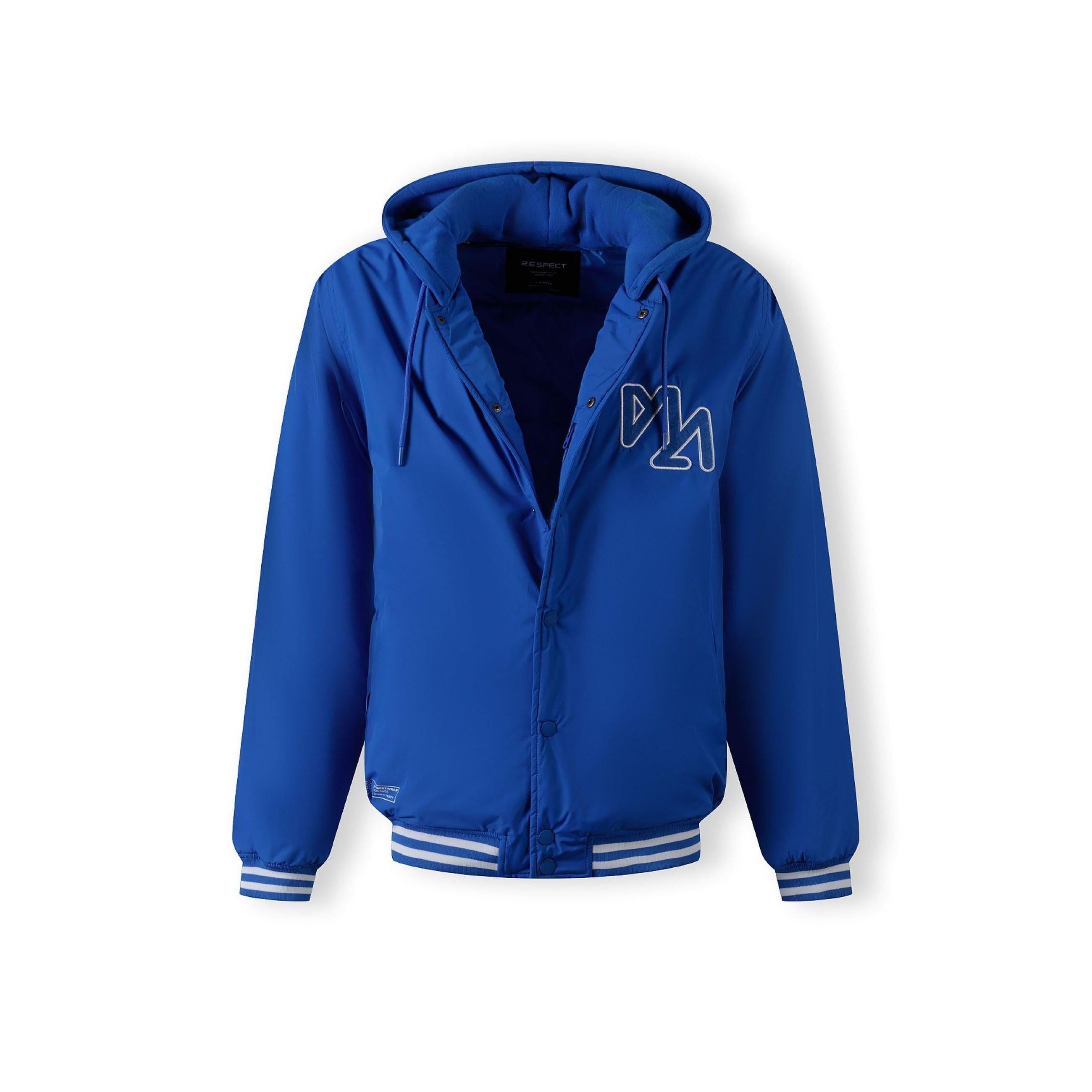 Close-up detail of cobalt blue jacket showing zip closure with matching blue zipper tape and snap button details