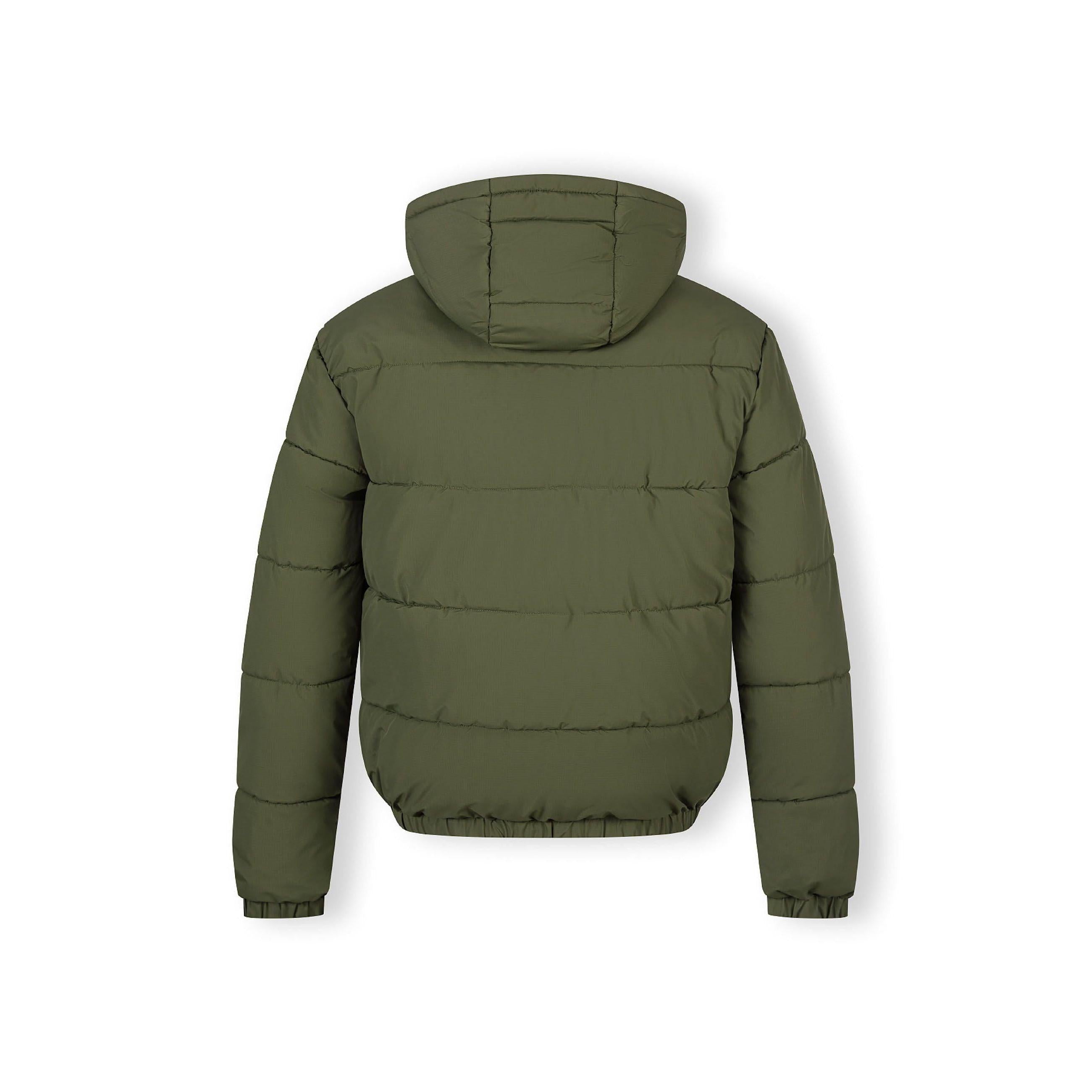 Close-up detail of black rectangular brand patch on khaki quilted jacket sleeve