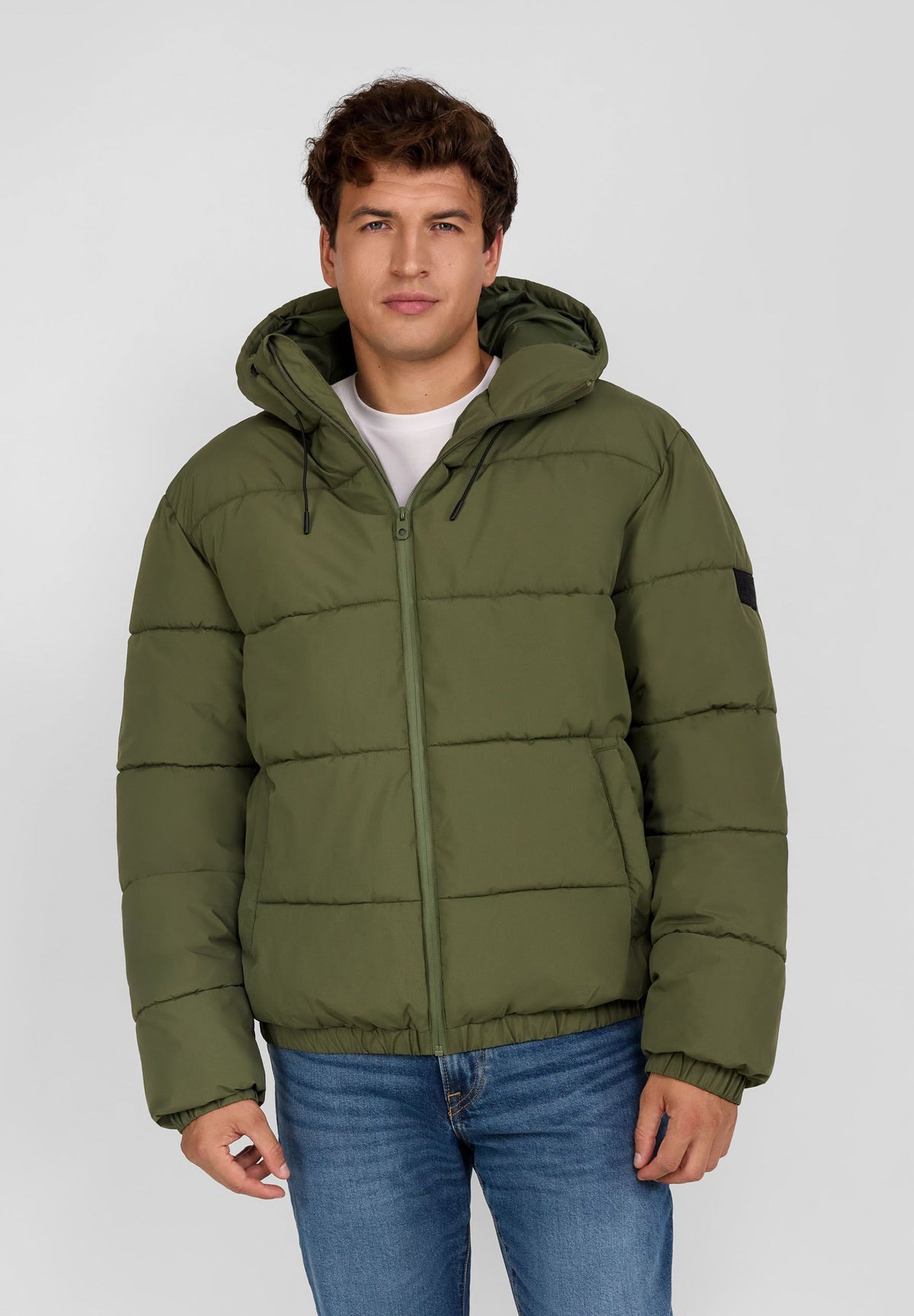 Men's khaki puffer jacket, shown worn.