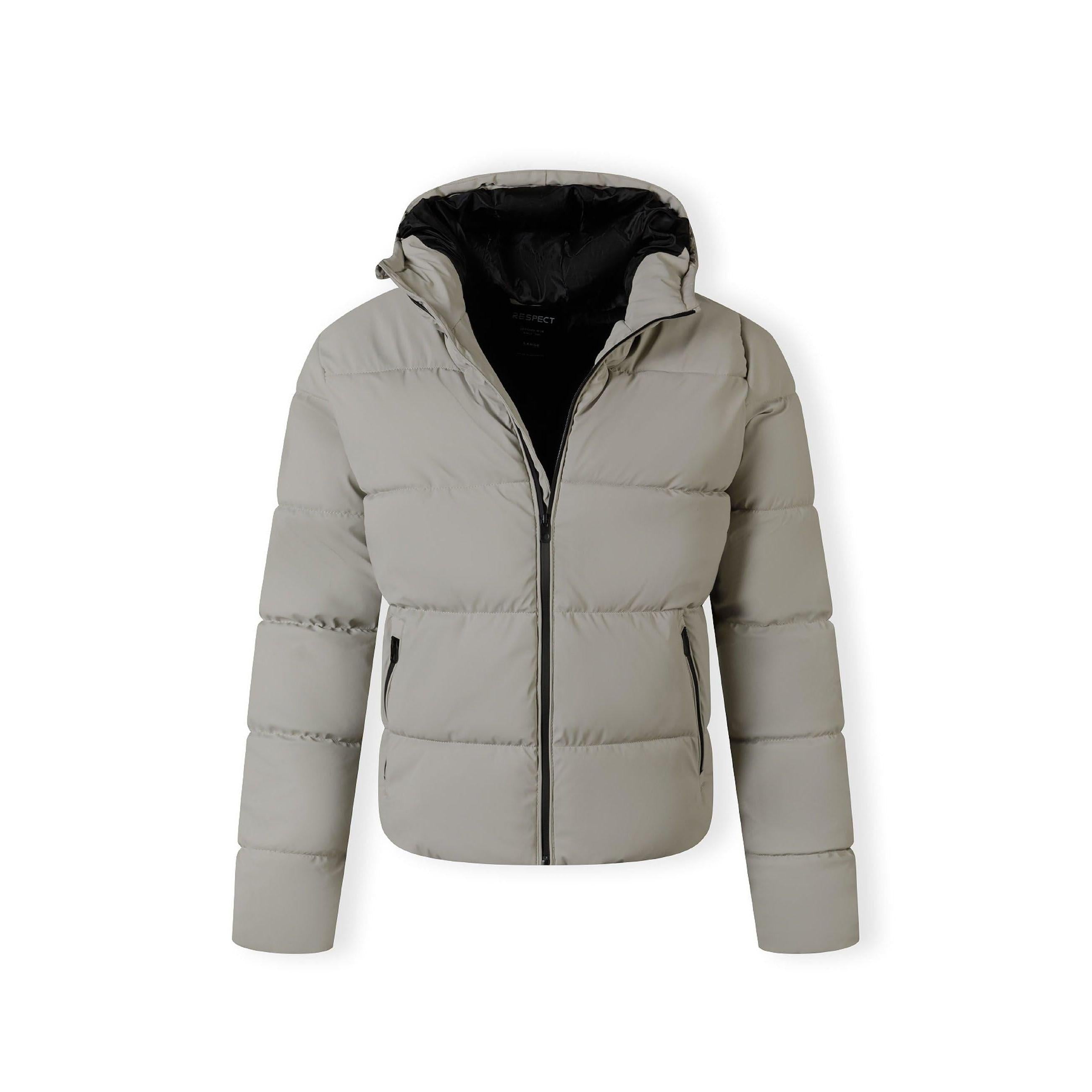 Close-up detail of side zip pocket on beige padded jacket showing black zipper and pocket construction