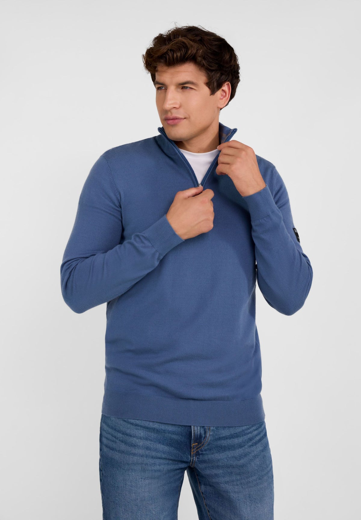 Men's blue half zip jumper with stand collar, ribbed cuffs, and flexible hem.