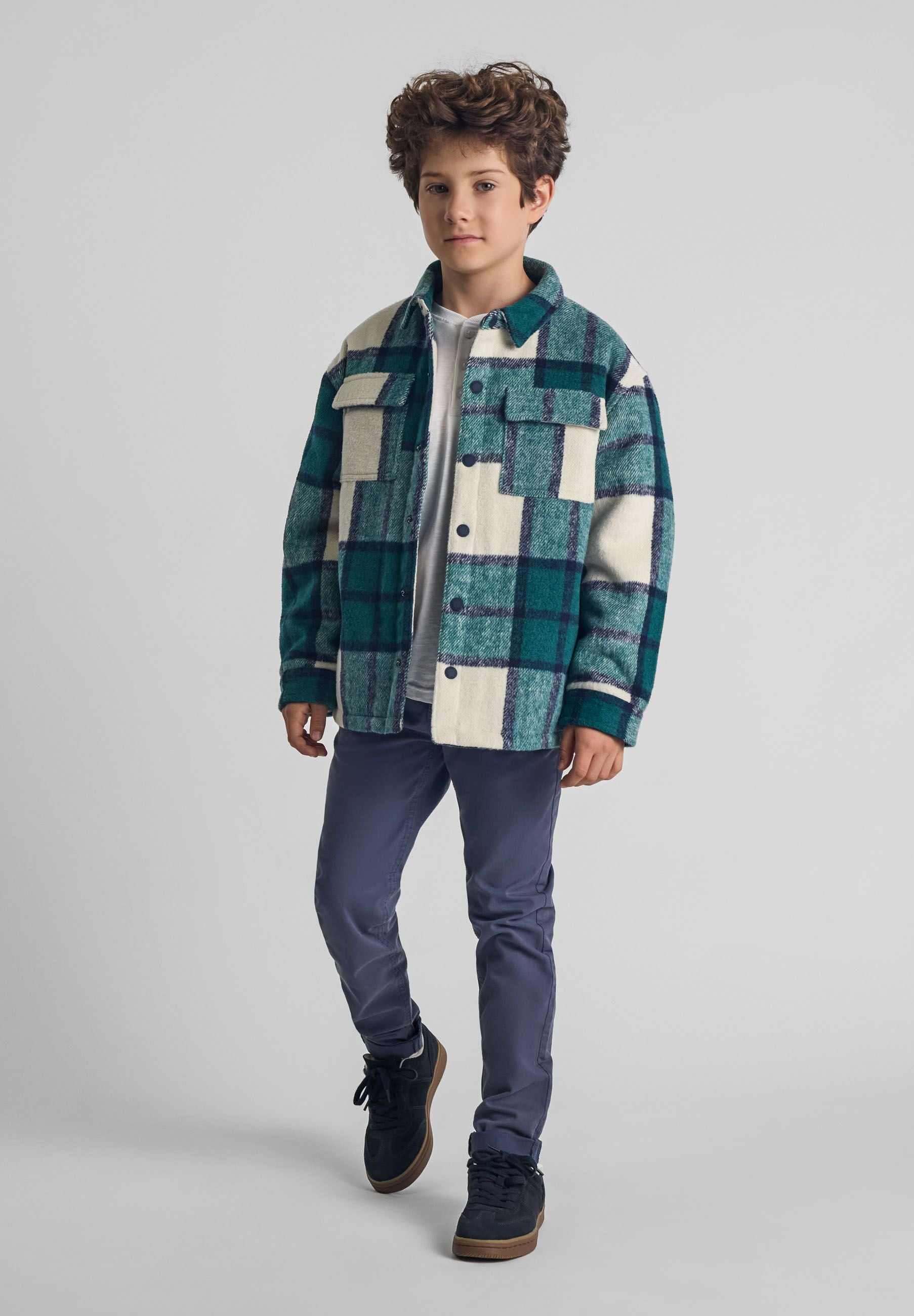 Boys padded shirt jacket in green check pattern, front view with patch pockets.