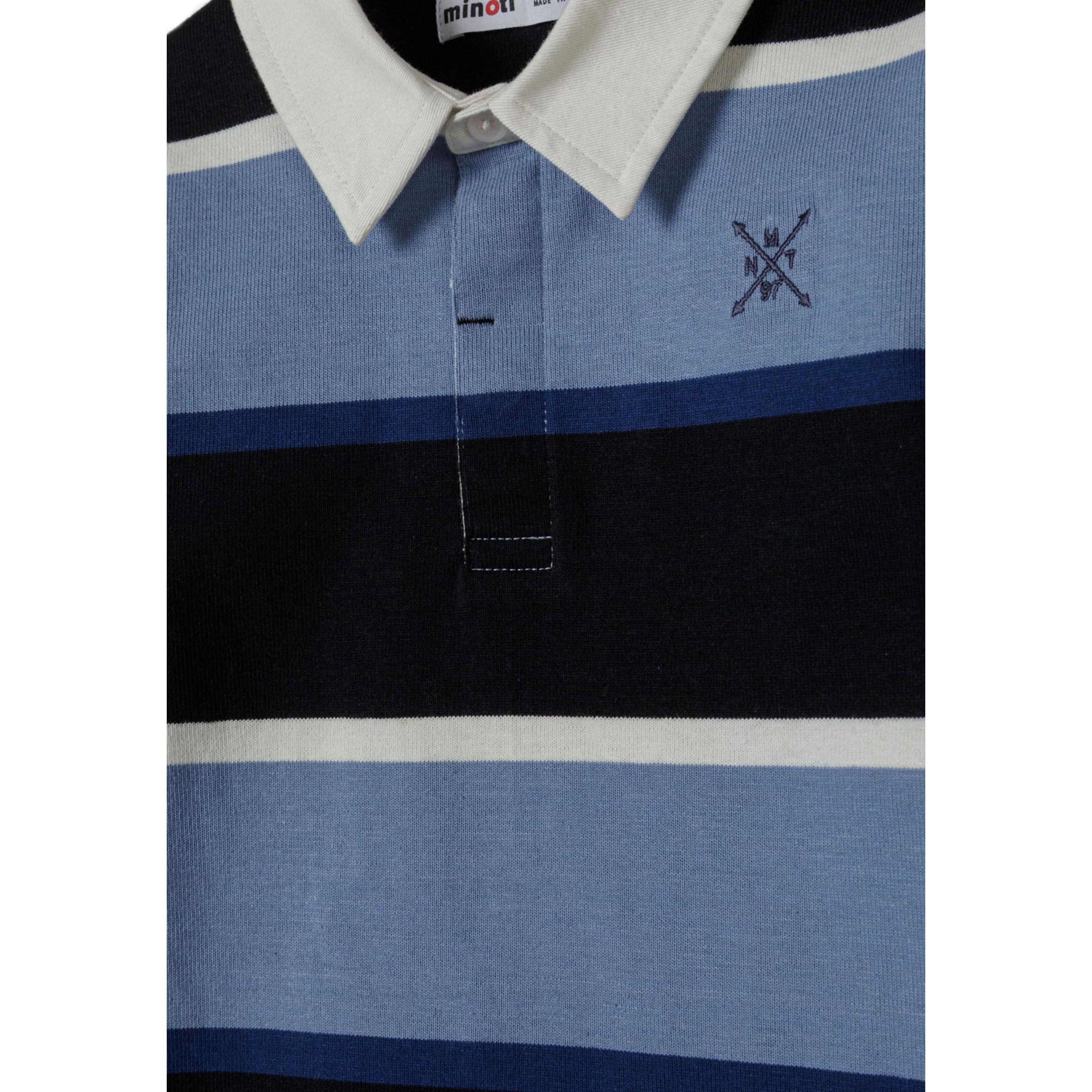 Close-up detail of polo shirt collar and chest area showing white collar, button placket, and small embroidered cross logo on light blue stripe