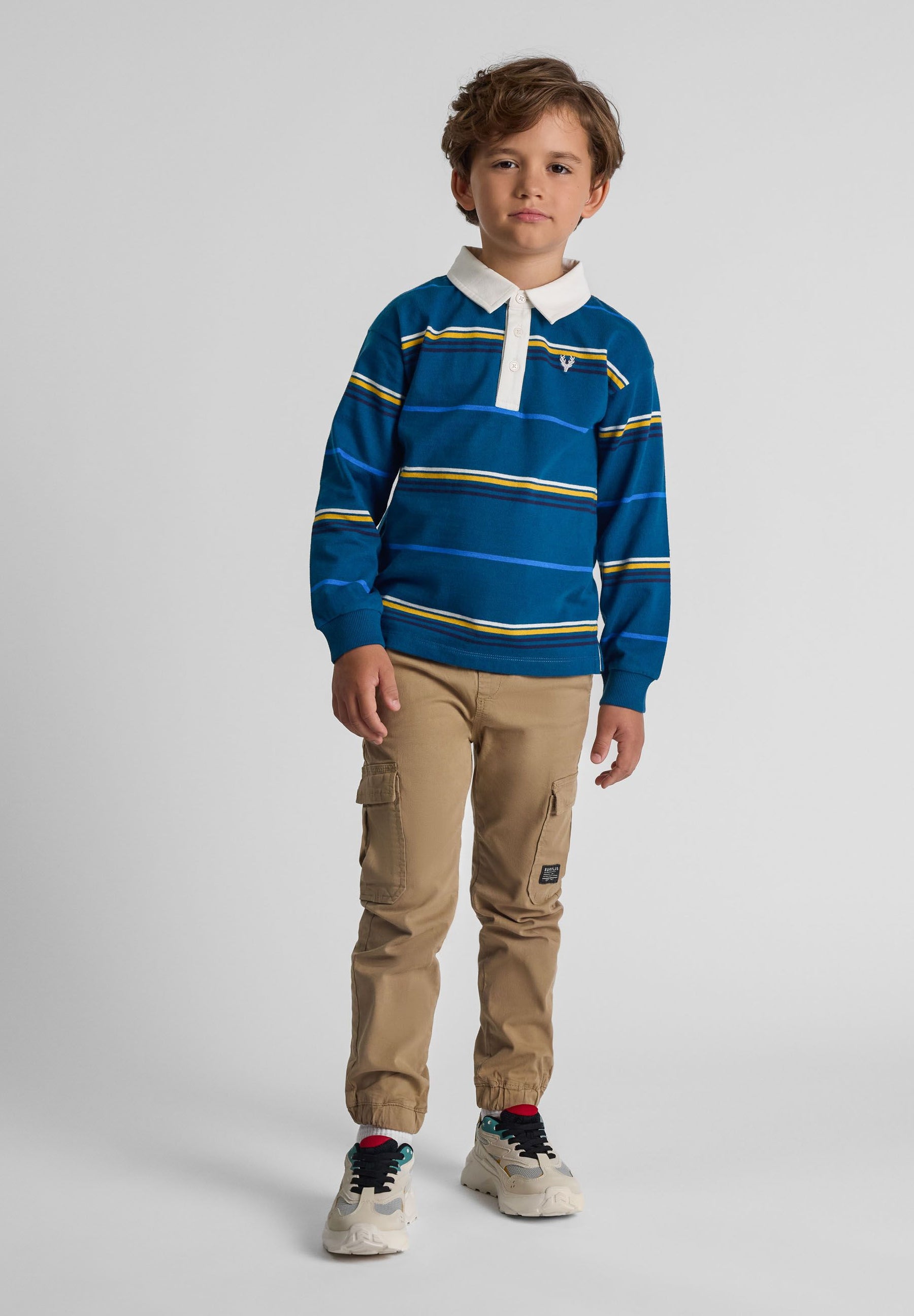 Boys long sleeve polo shirt in turquoise with white and yellow stripes, featuring a woven collar and button placket.