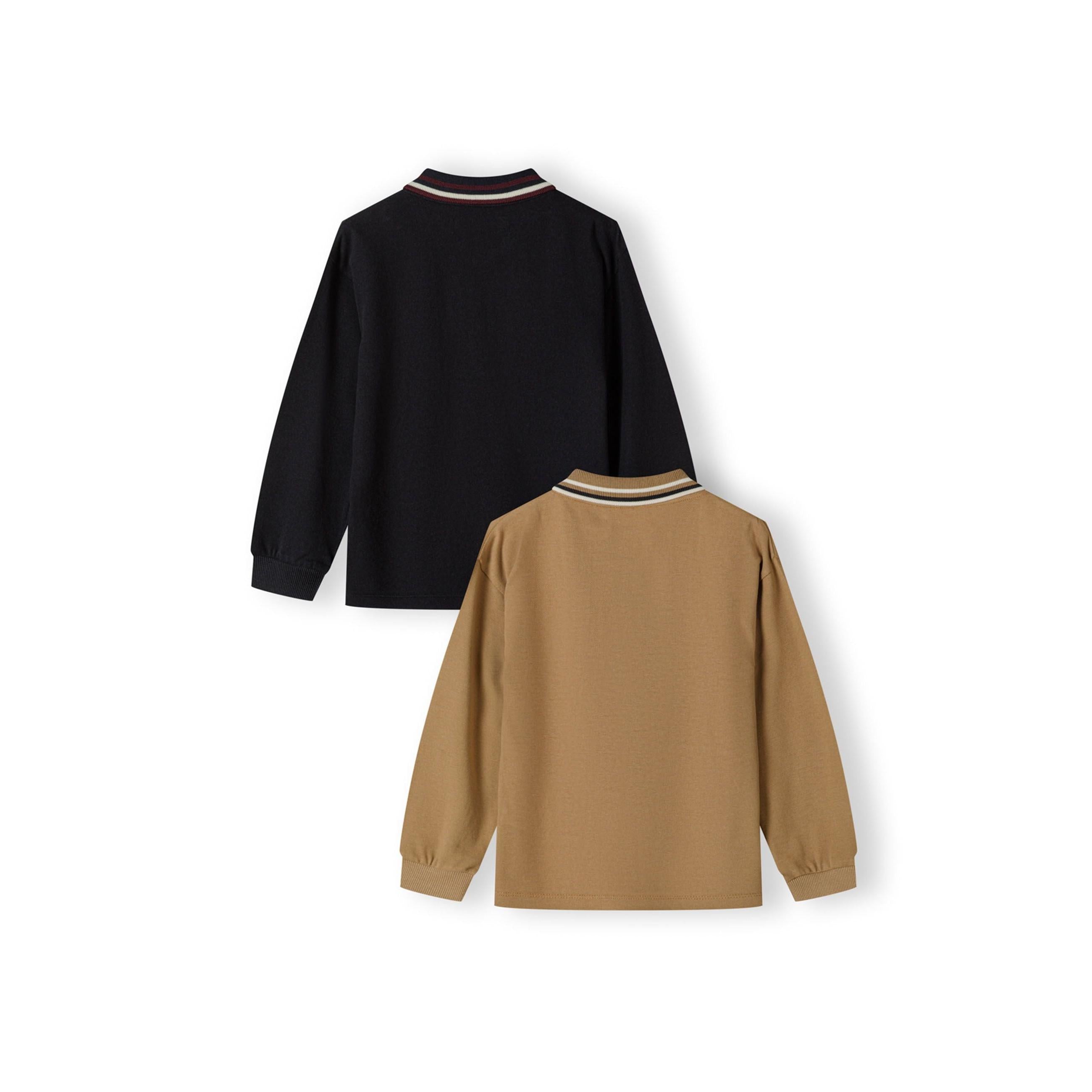 Single tan coloured long sleeve polo shirt laid flat on white background, showing tipped collar detail, button placket and small dark embroidered stag logo on left chest