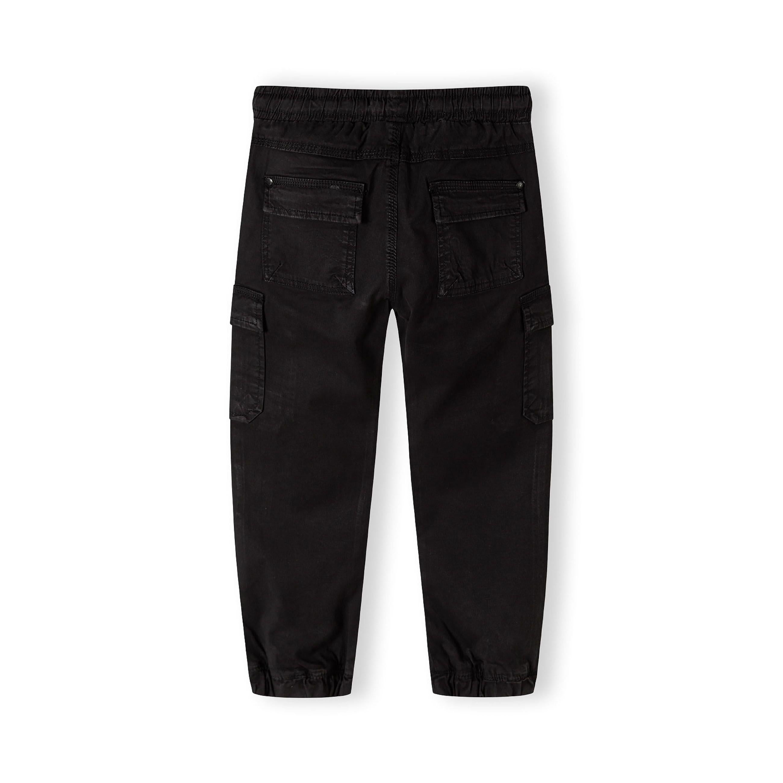 Back view of black cargo trousers showing elasticated waistband, back pockets and ankle cuffs on white background