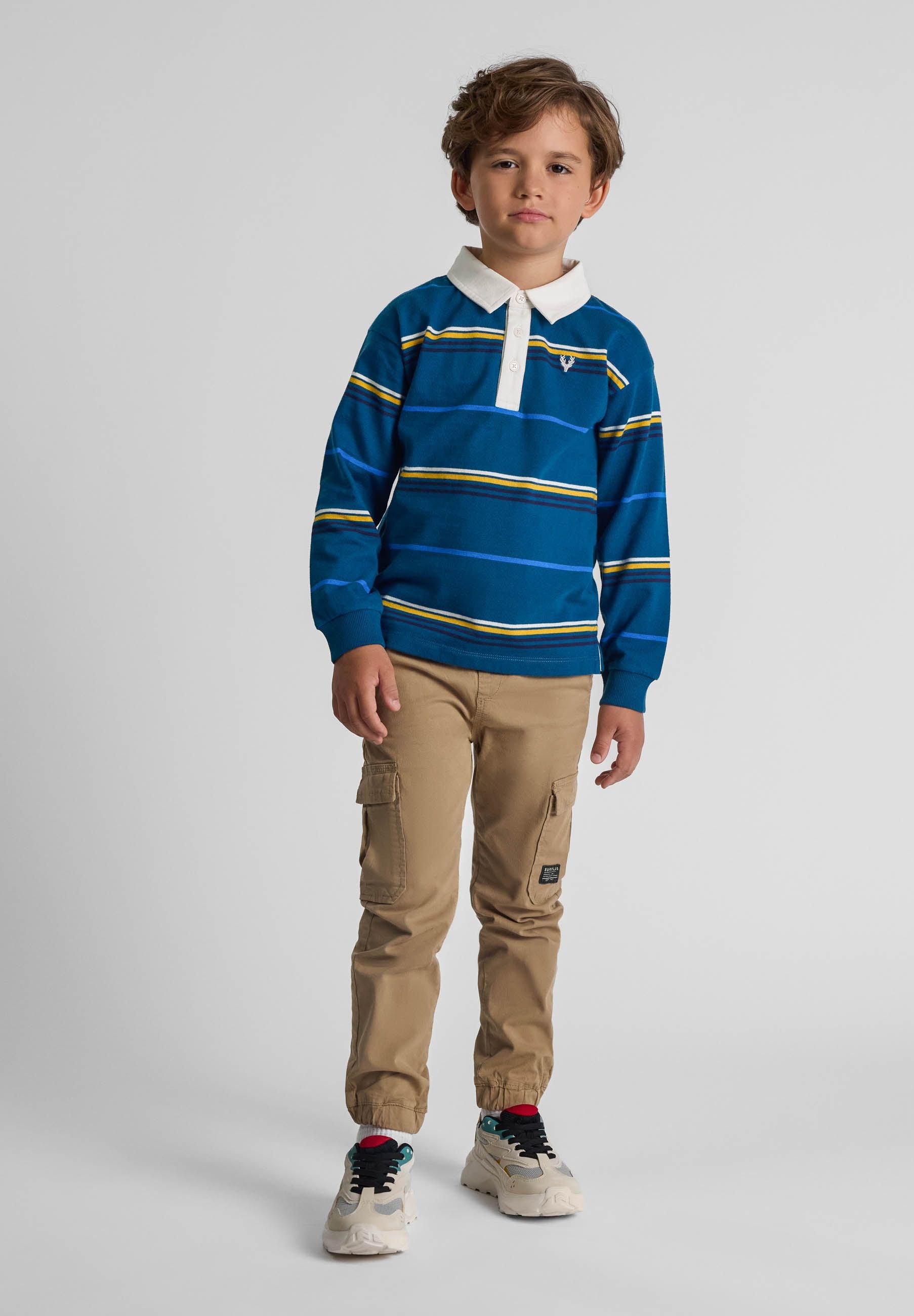 Boys grey cargo trousers with elastic waist and side pockets, front view.