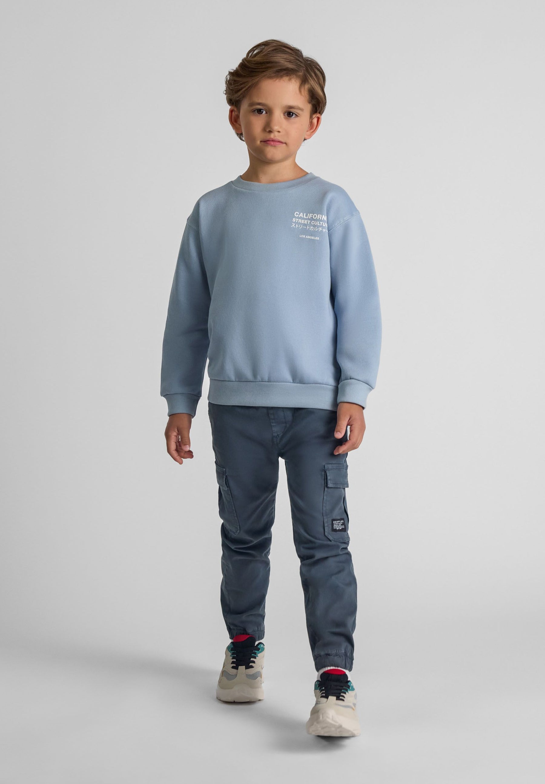 Boys cargo trousers, blue, front view, elastic waistband, side cargo pockets.
