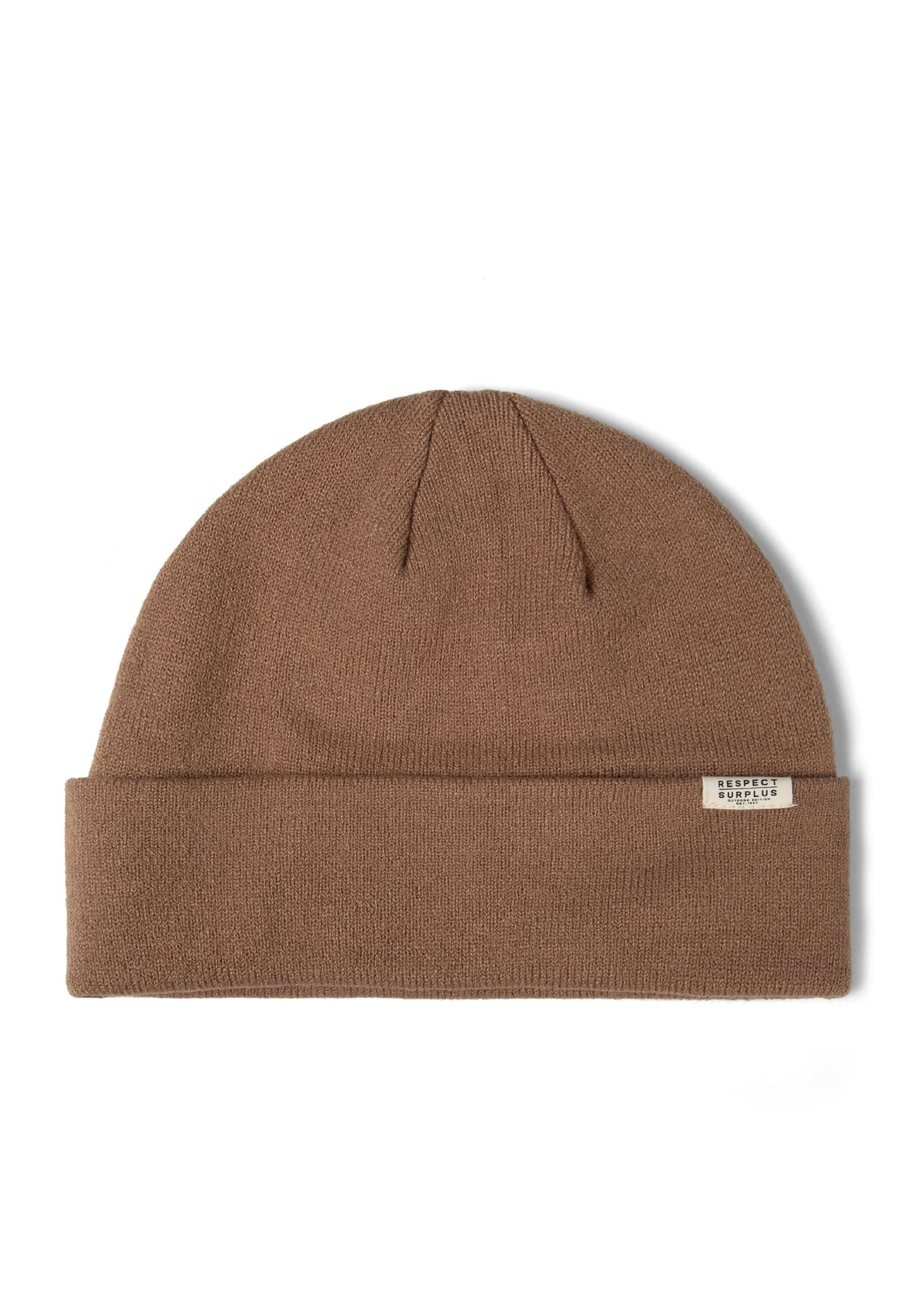 Detail of a brown ribbed beanie hat with a fold-up cuff and a logo badge.