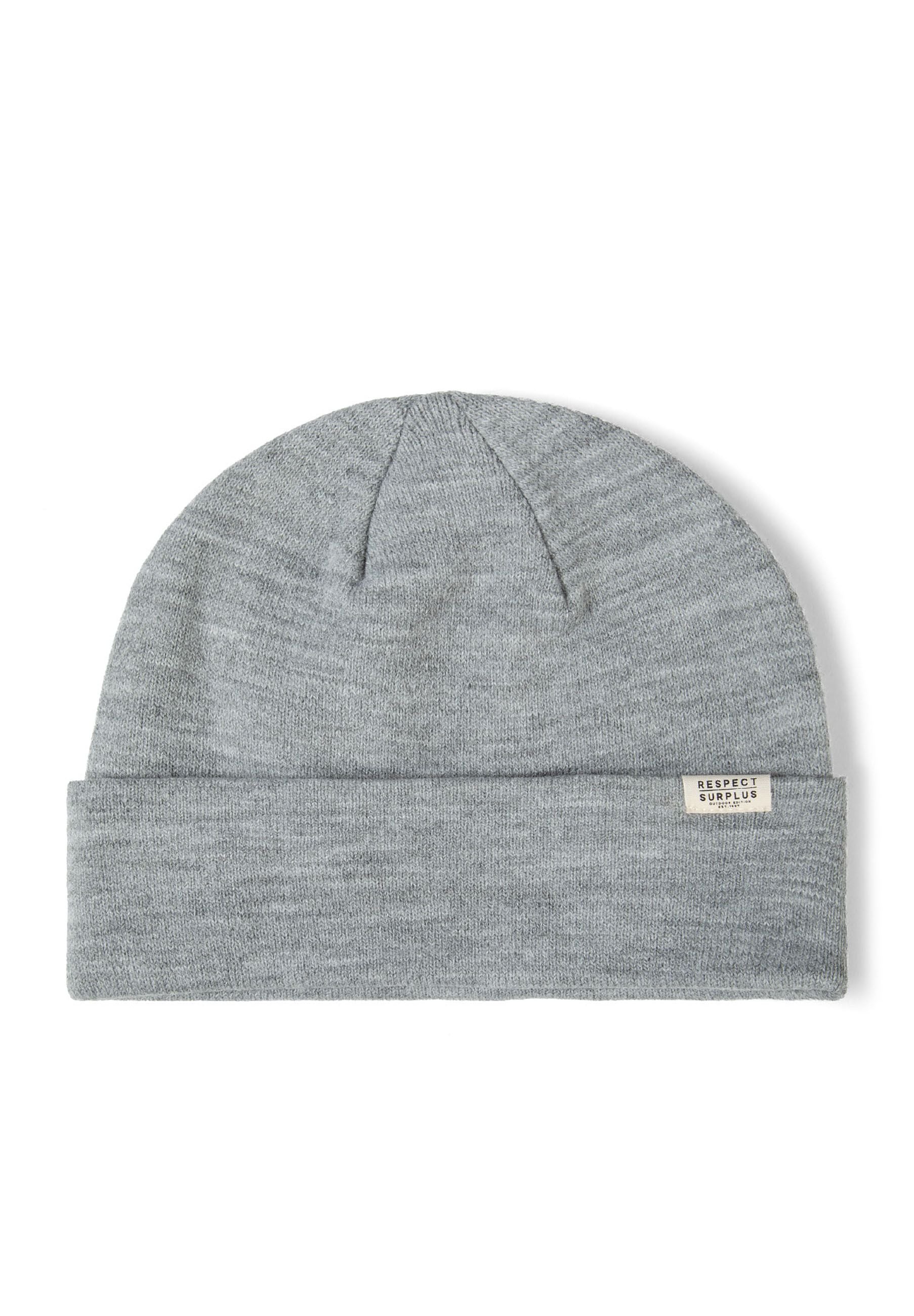 Close-up of a grey ribbed beanie hat with a fold-up cuff and a small badge.