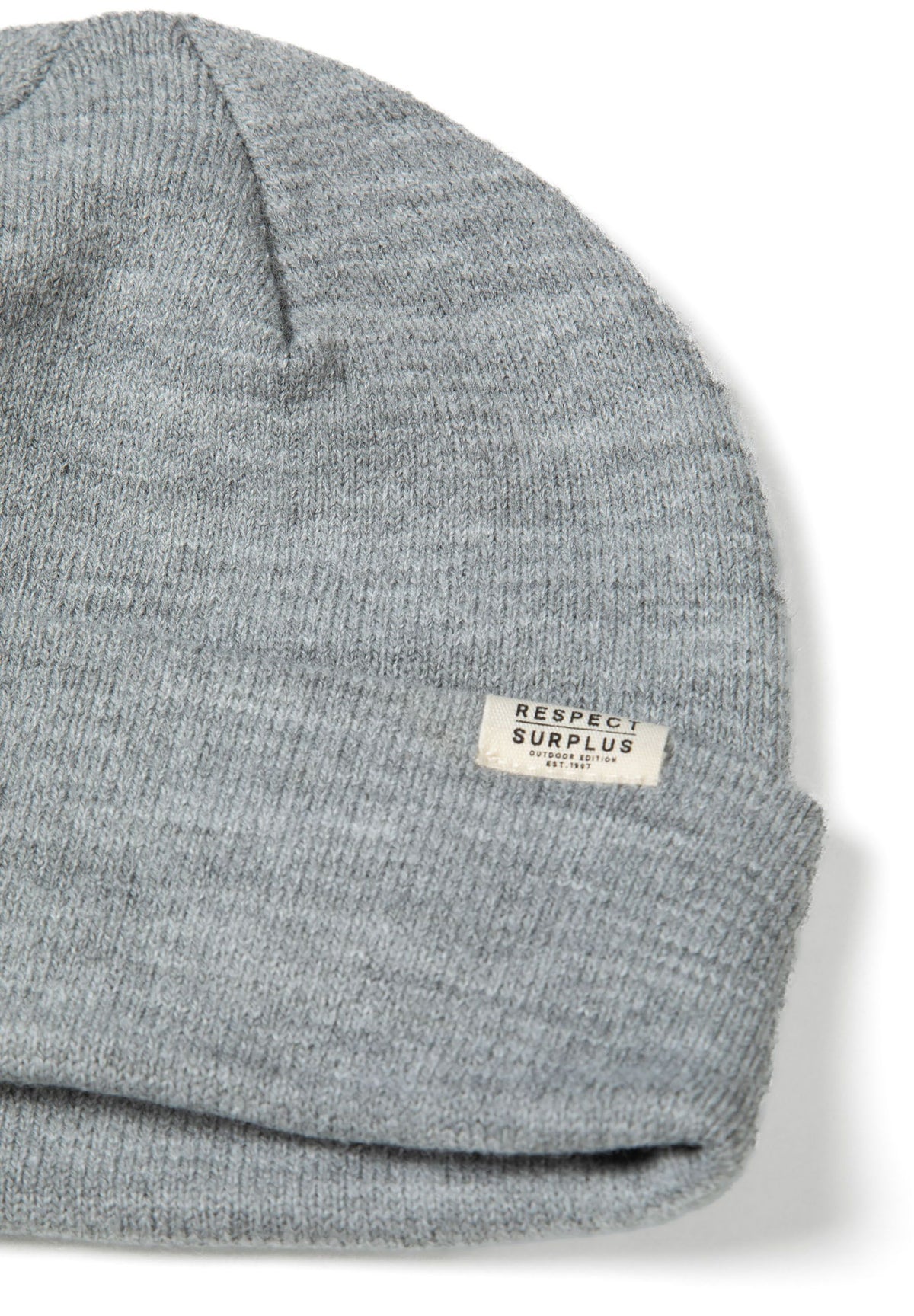 Close-up of light grey marl beanie's folded cuff and RESPECT SURPLUS tag.