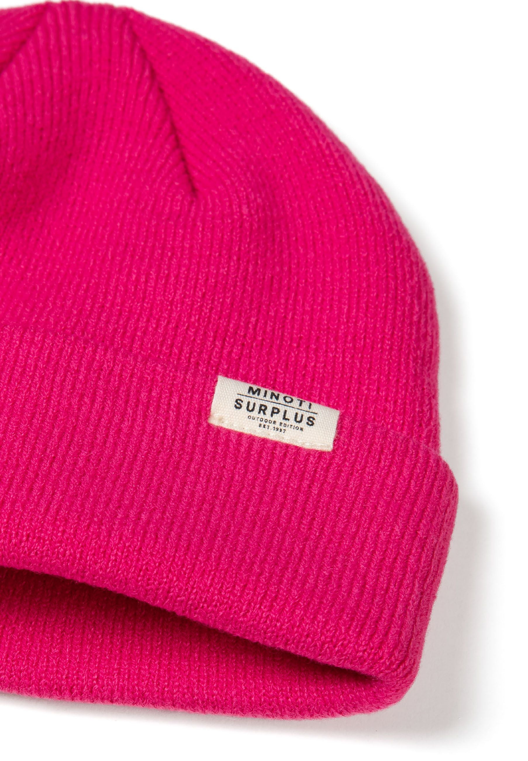 Detail of a pink ribbed beanie hat with a fold-up cuff and logo badge.