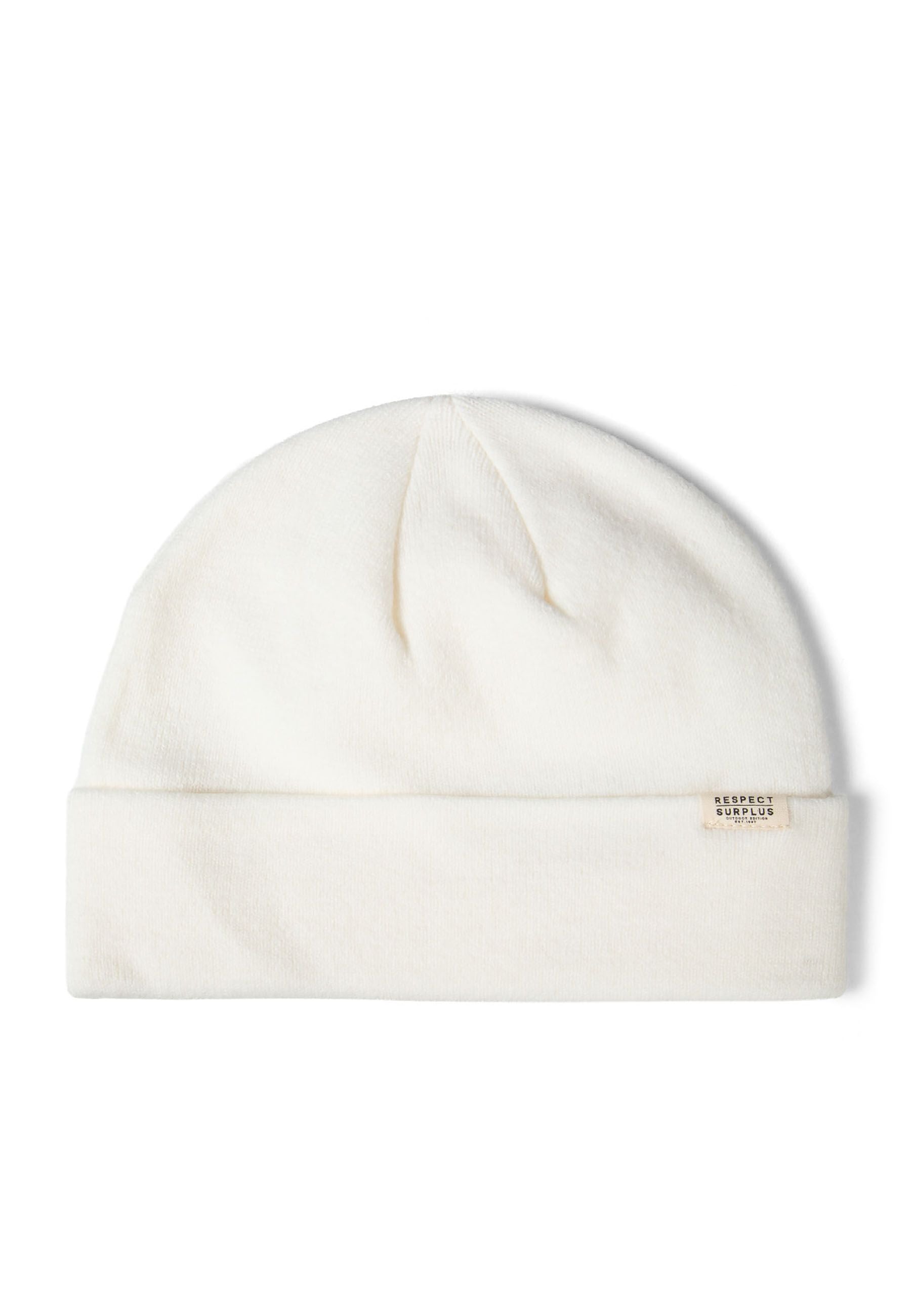 Close-up of a white ribbed beanie hat with a cuff and a subtle badge.