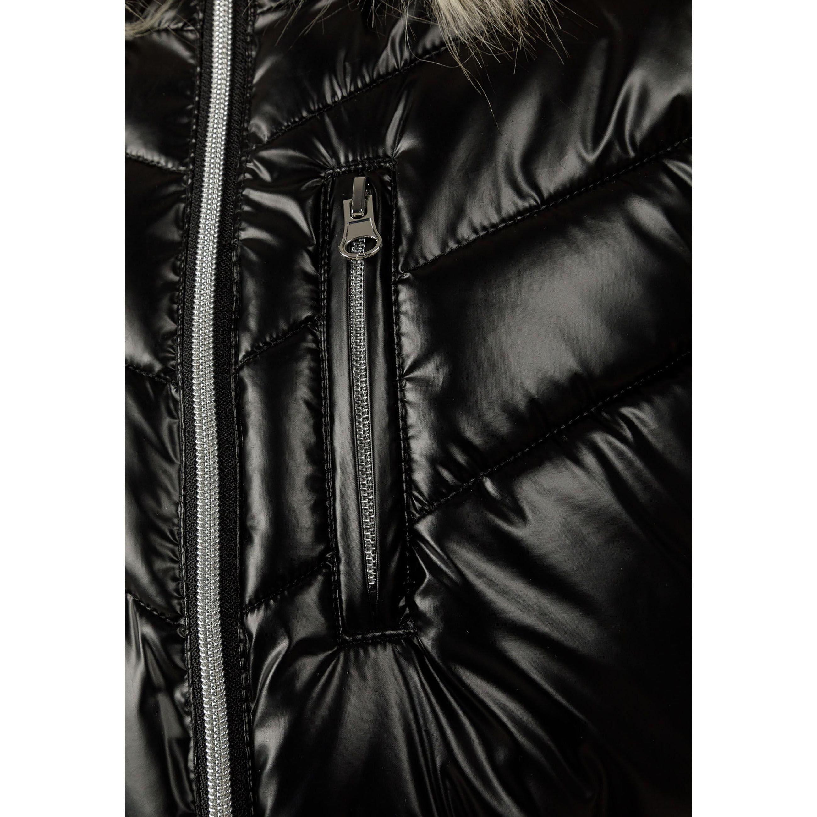 Close-up detail of black quilted parka showing chest pocket with snap closure and quilted texture against white background