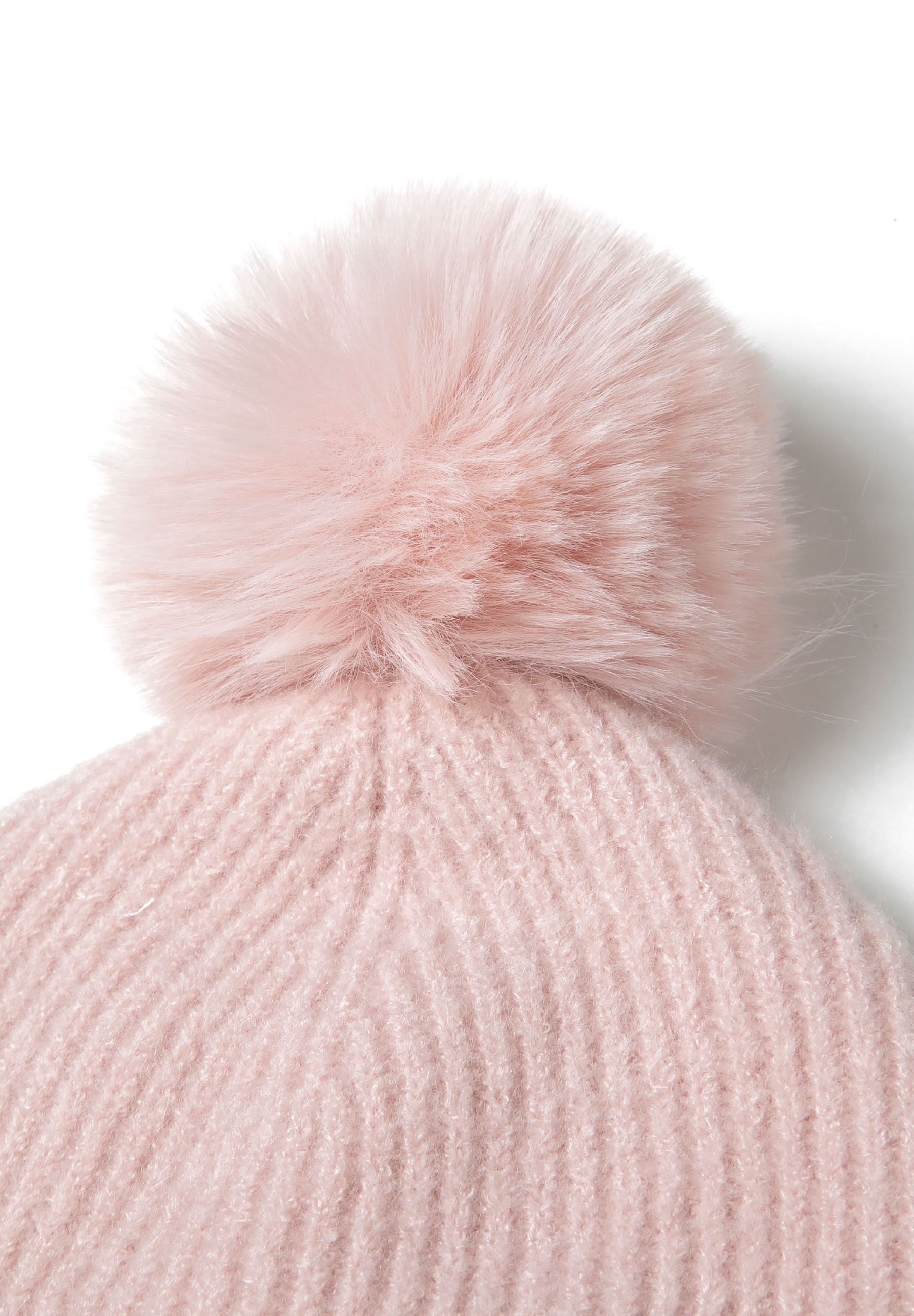 Detail of a pink ribbed knit scarf with a soft texture.
