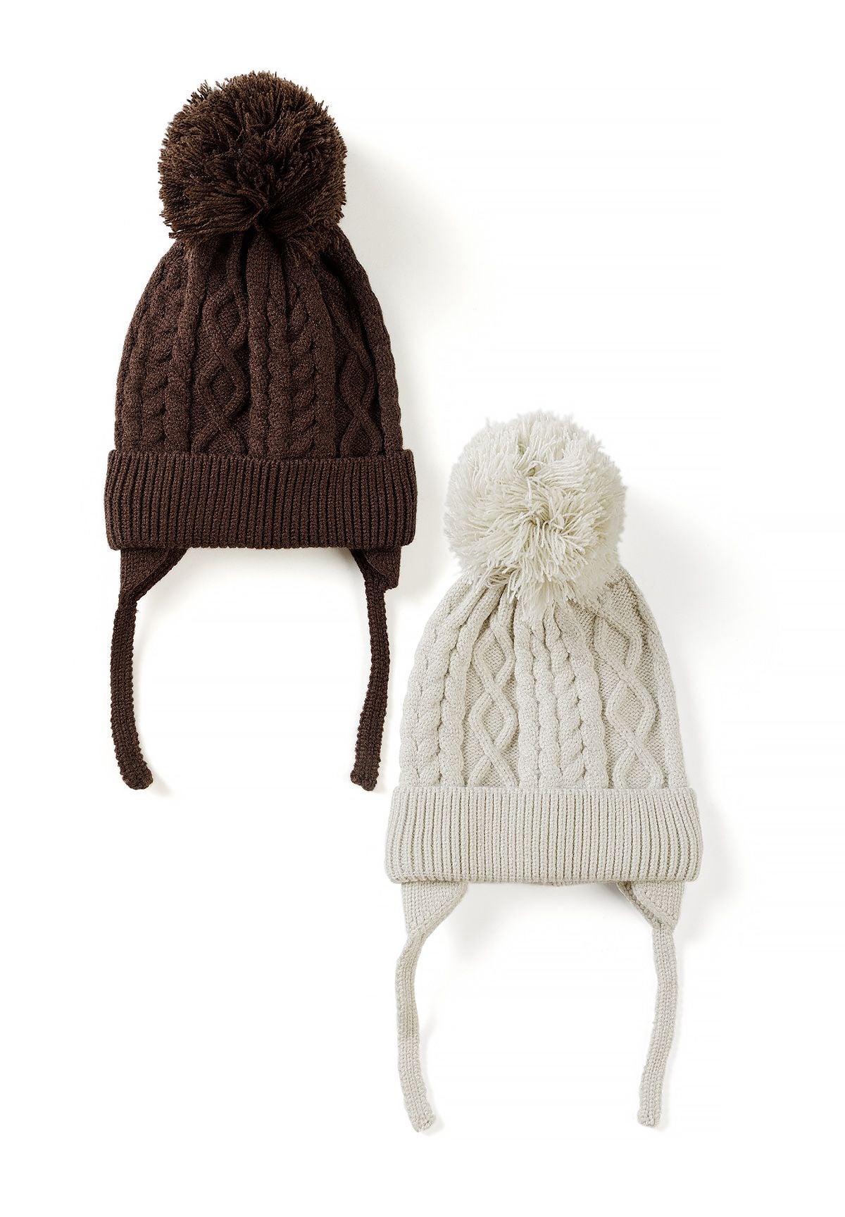 Brown and cream baby cable-knit hats with yarn pom-poms, folded brims and earflap ties, 2-pack.