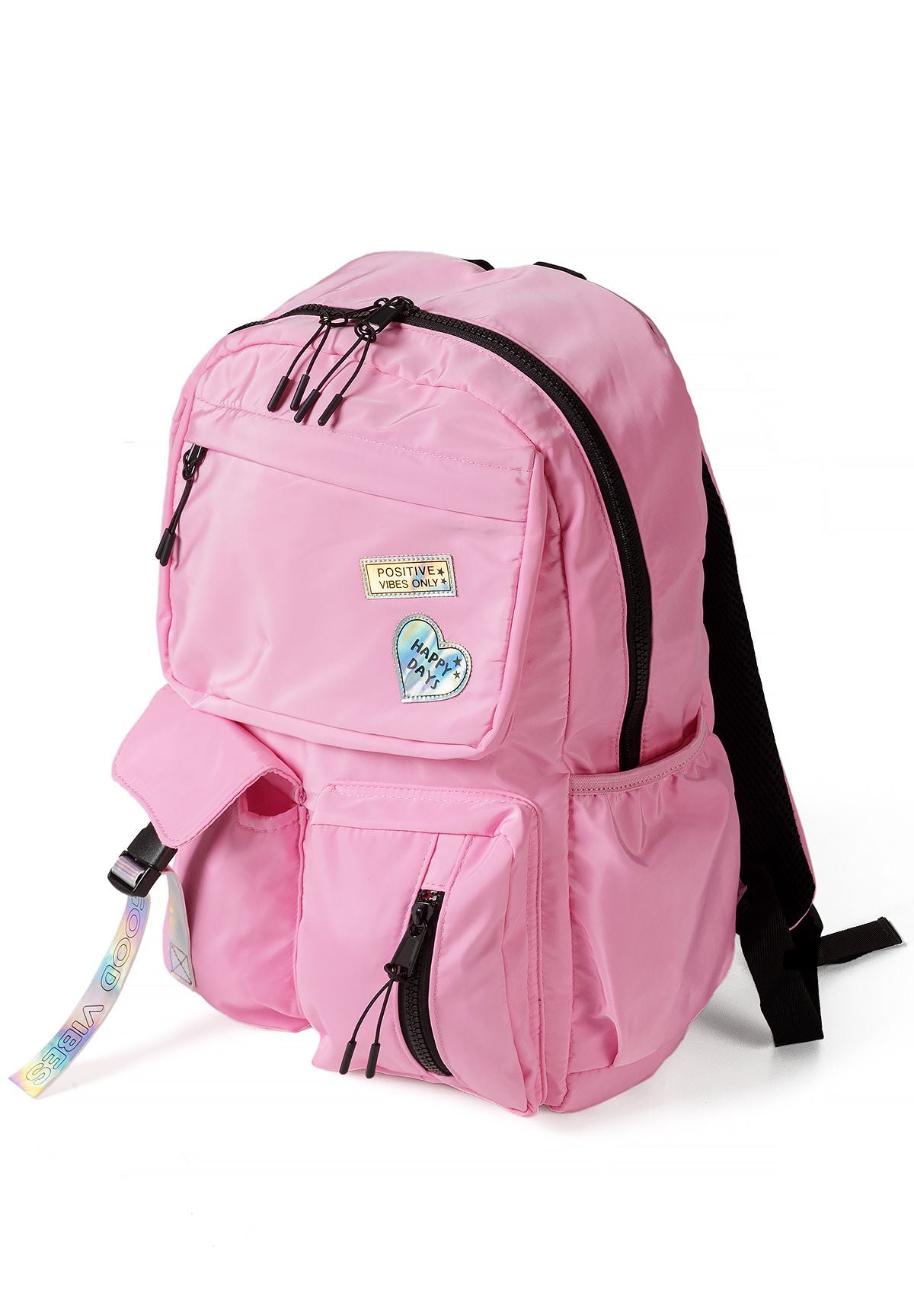 Roze meisjesrugzak met glanzende badges, zijaanzicht.