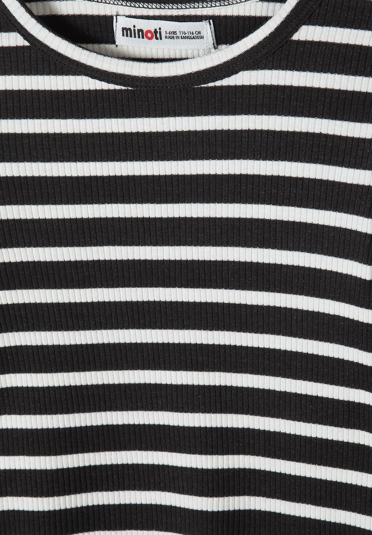 Close-up of fine ribs and white horizontal stripes on black dress.