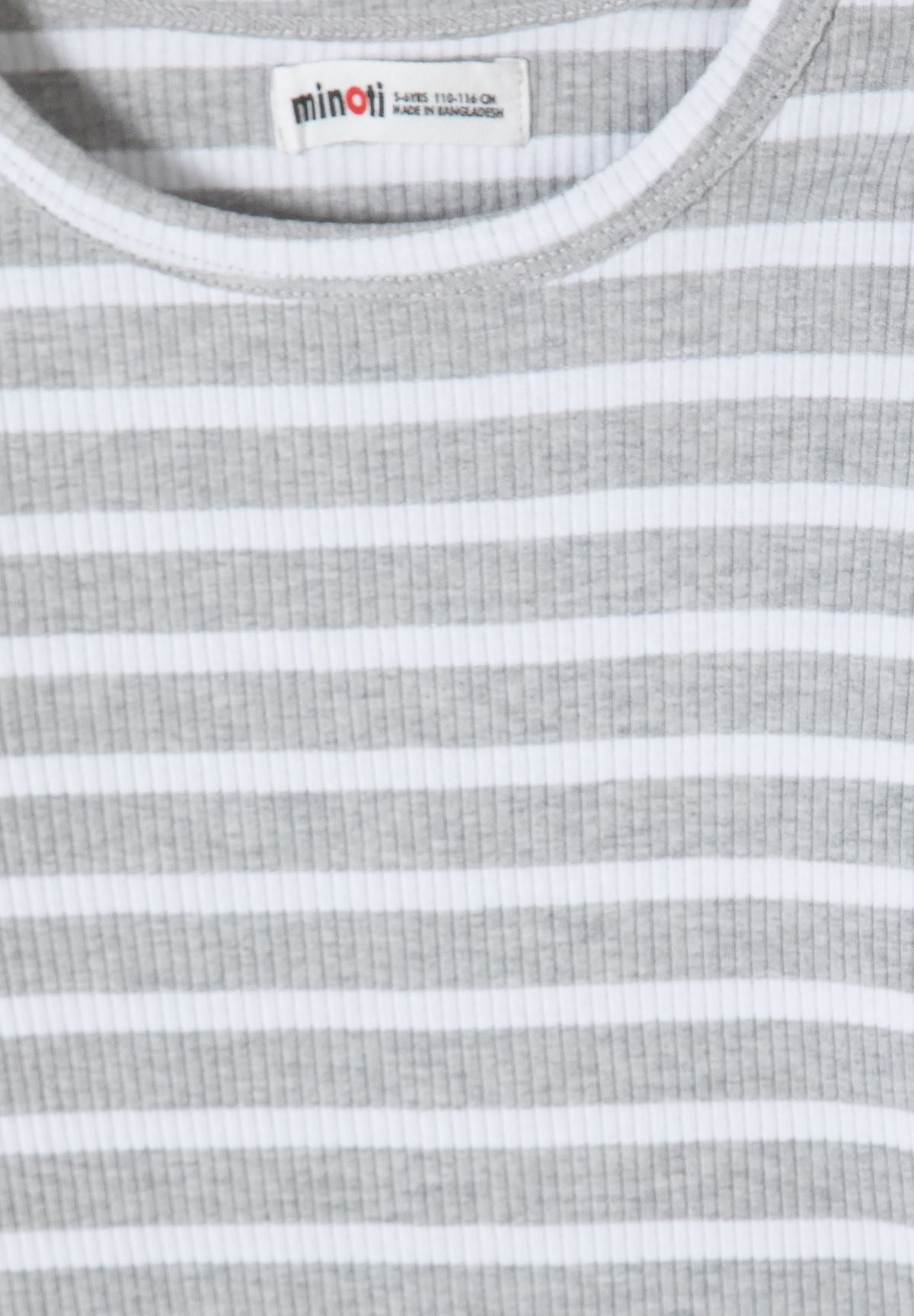 Close-up of grey and white horizontal stripes over fine vertical ribbing.