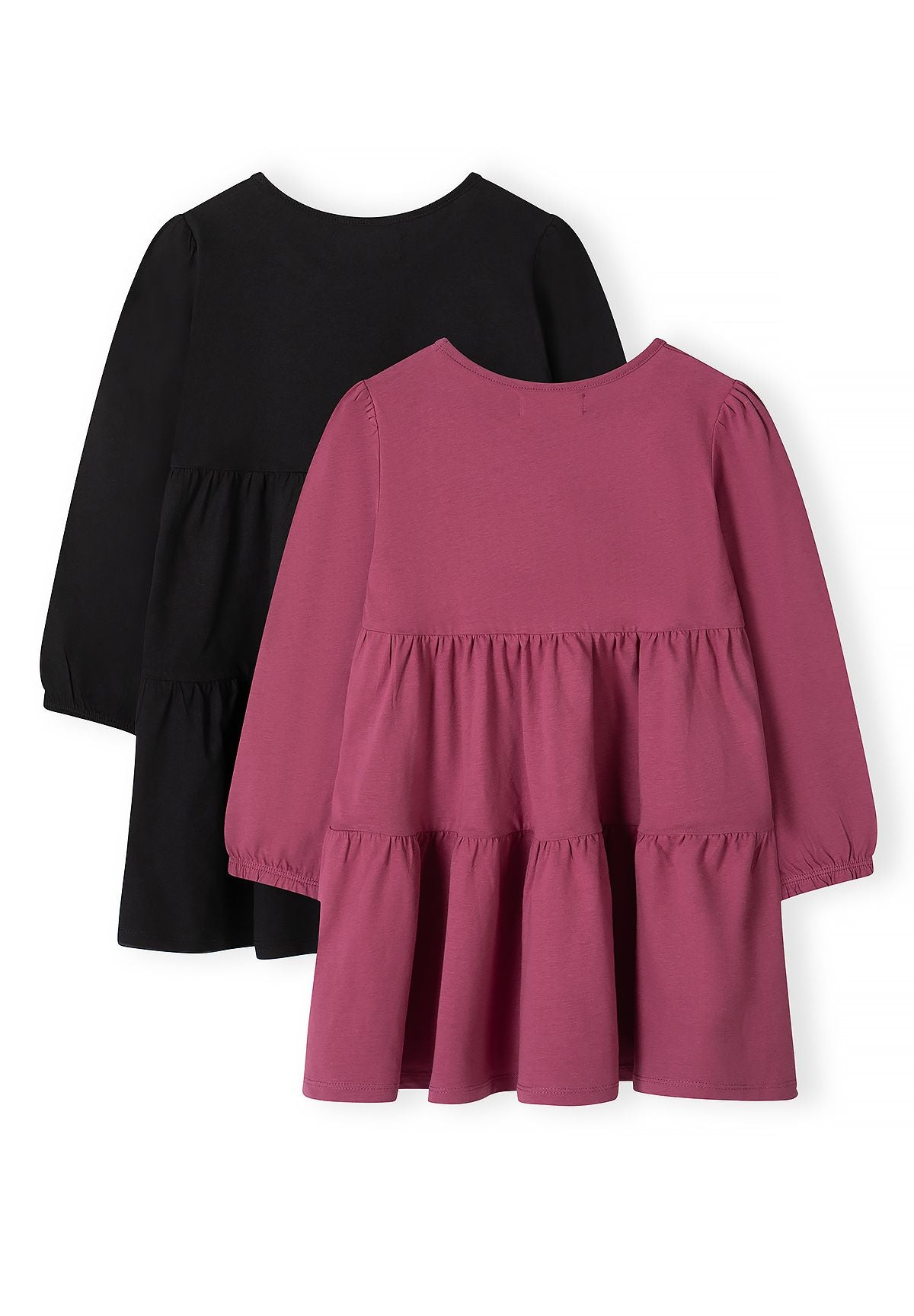 Back of black and berry-pink long-sleeved dresses with gathered skirt tiers.