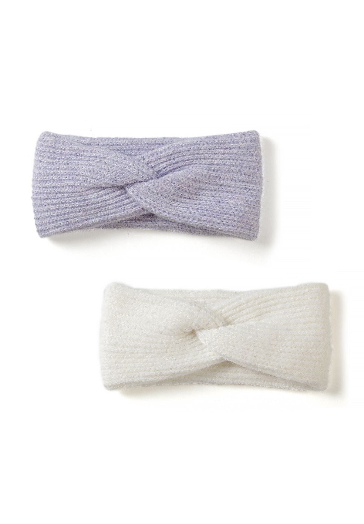 Two wide rib-knit twist-front headbands in lilac and ivory, arranged one above the other.