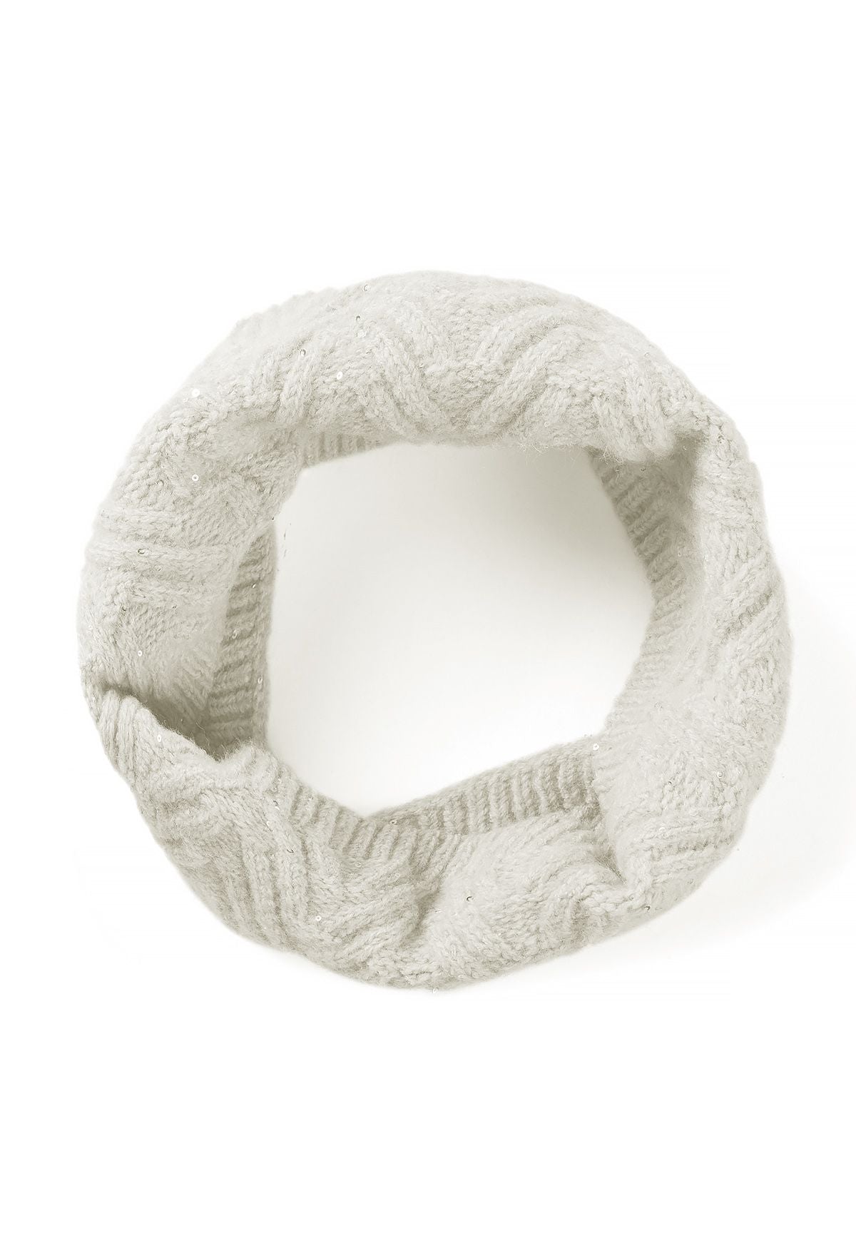 Cream cable-knit snood arranged as a loop, showing its continuous tubular shape and ribbed opening.