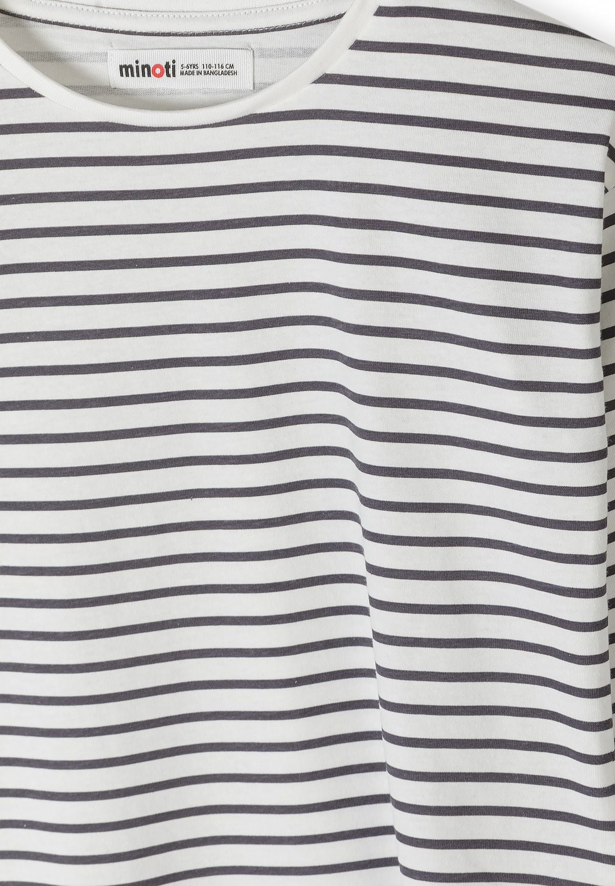 Close-up of charcoal horizontal stripes on off-white top.