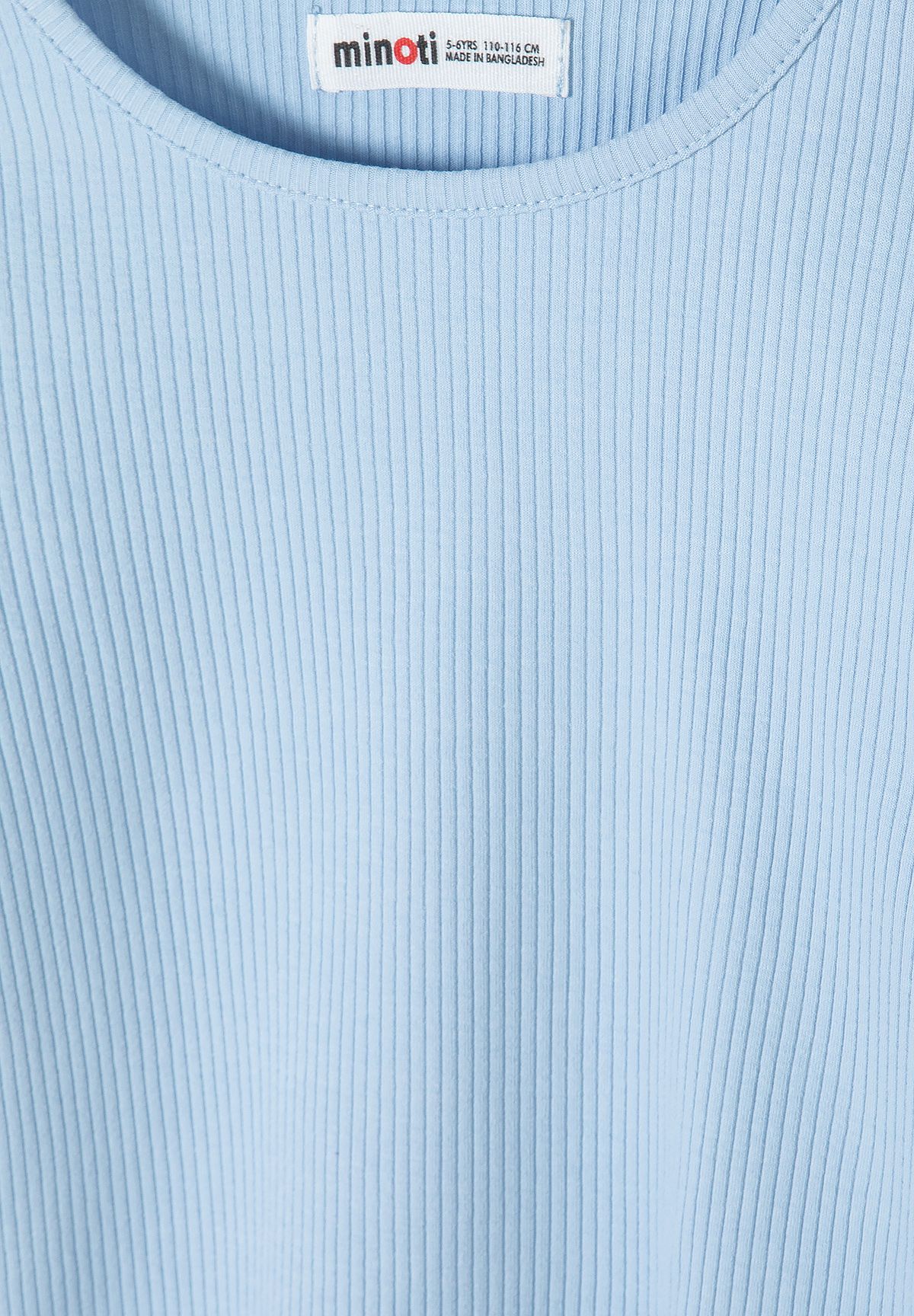 Close-up of pale blue top's round neckline and vertical ribbing.