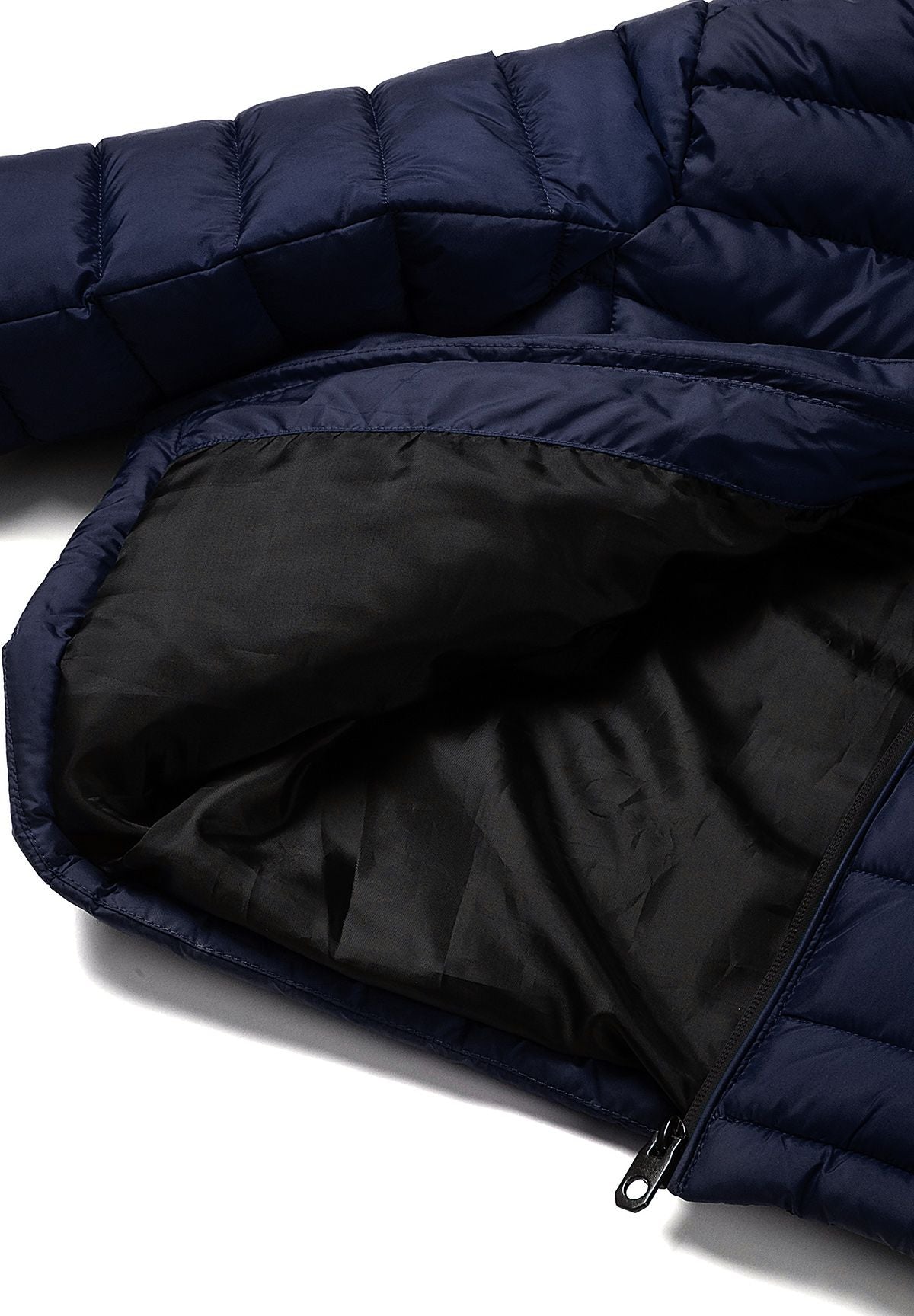 Inside view of the navy puffer jacket showing smooth black lining beneath its quilted shell.
