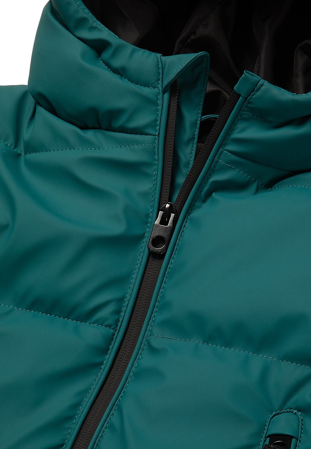 Close-up of the black centre zip at the teal jacket's high padded neckline.