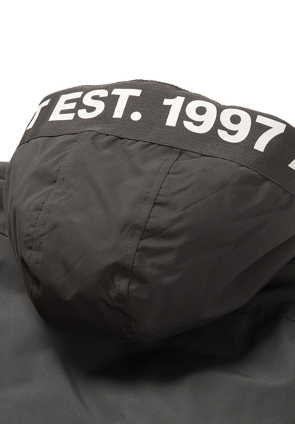 Close-up of bold white 'EST. 1997' lettering on the back rim of the charcoal parka hood.