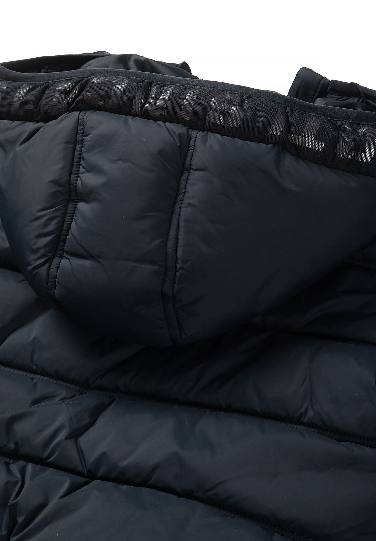 Close-up of the navy puffer hood's dark printed edge band and stitched padded hood panels.