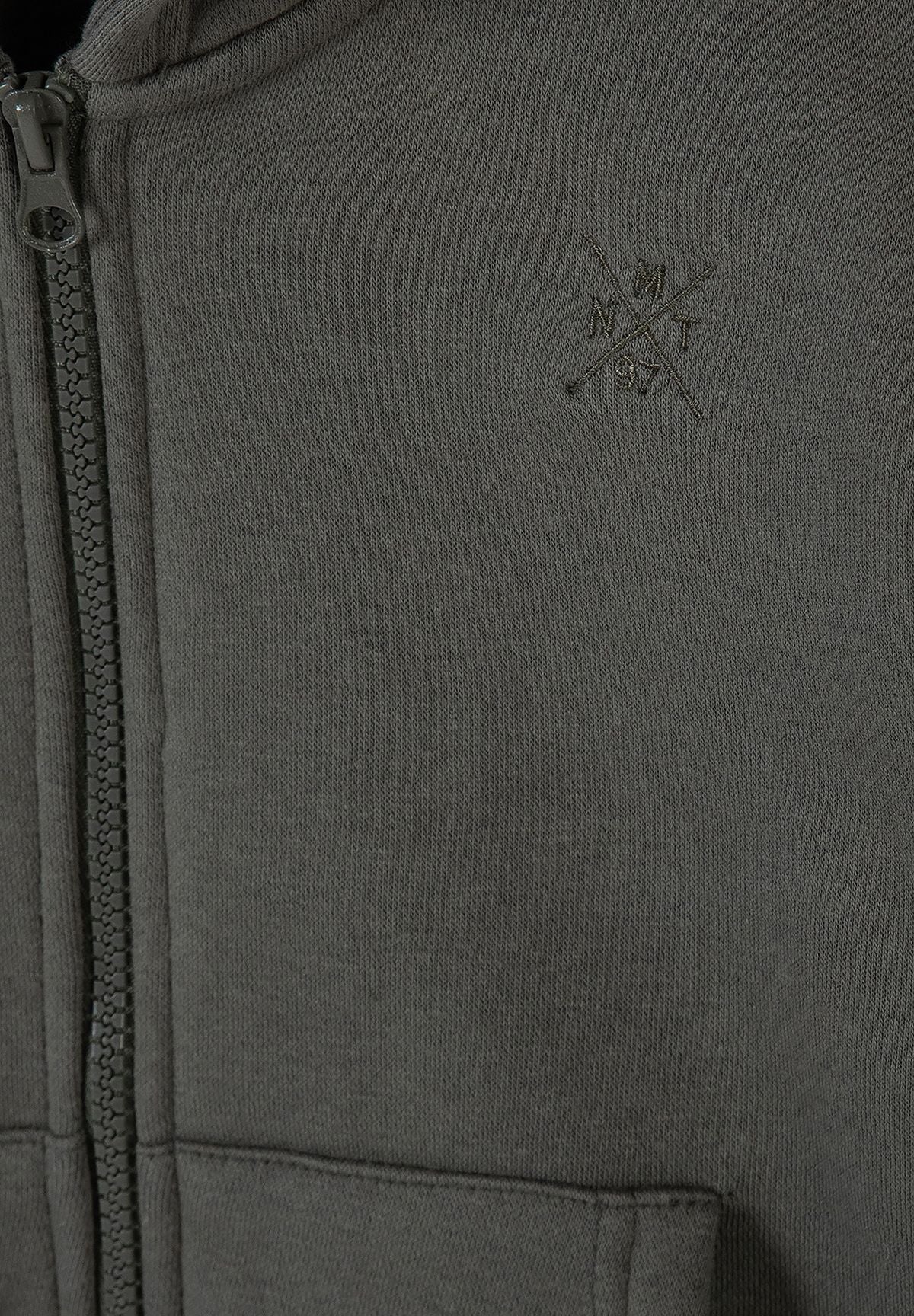 Close-up of olive-grey hoodie's zip, tonal chest embroidery and front pocket seam.