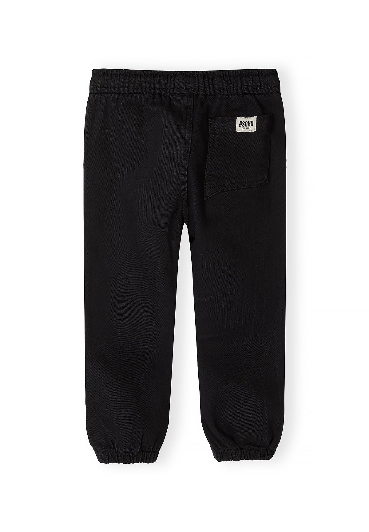 Zwarte broek met omgeslagen pijpen voor jongens, achterkant.
