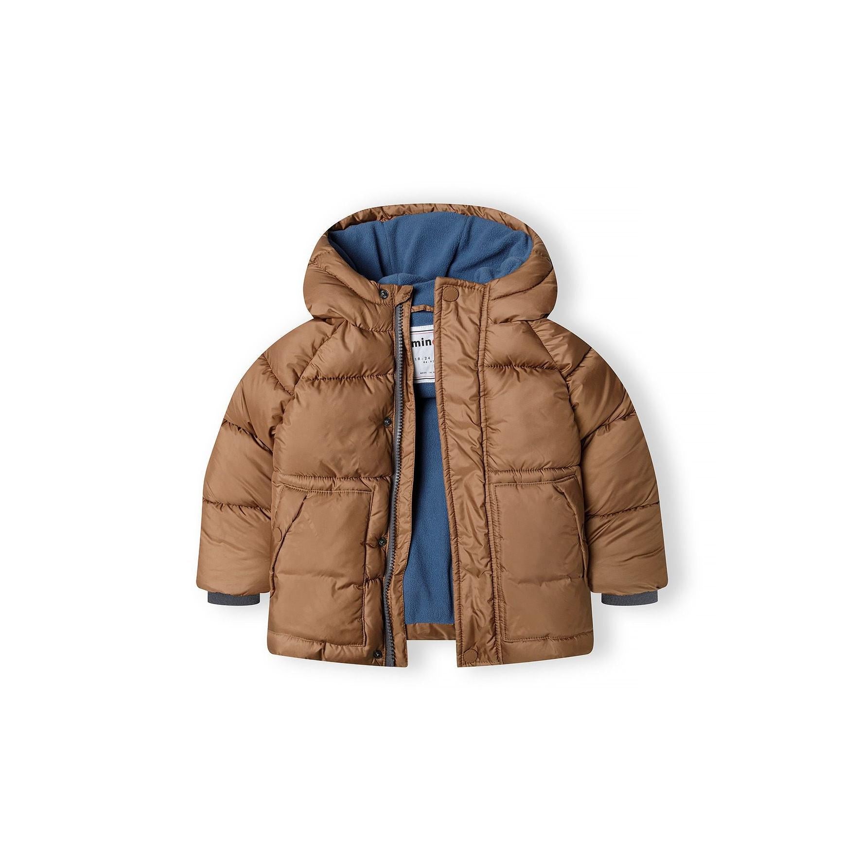 Close-up detail of brown padded jacket pocket with snap button closure and quilted fabric texture