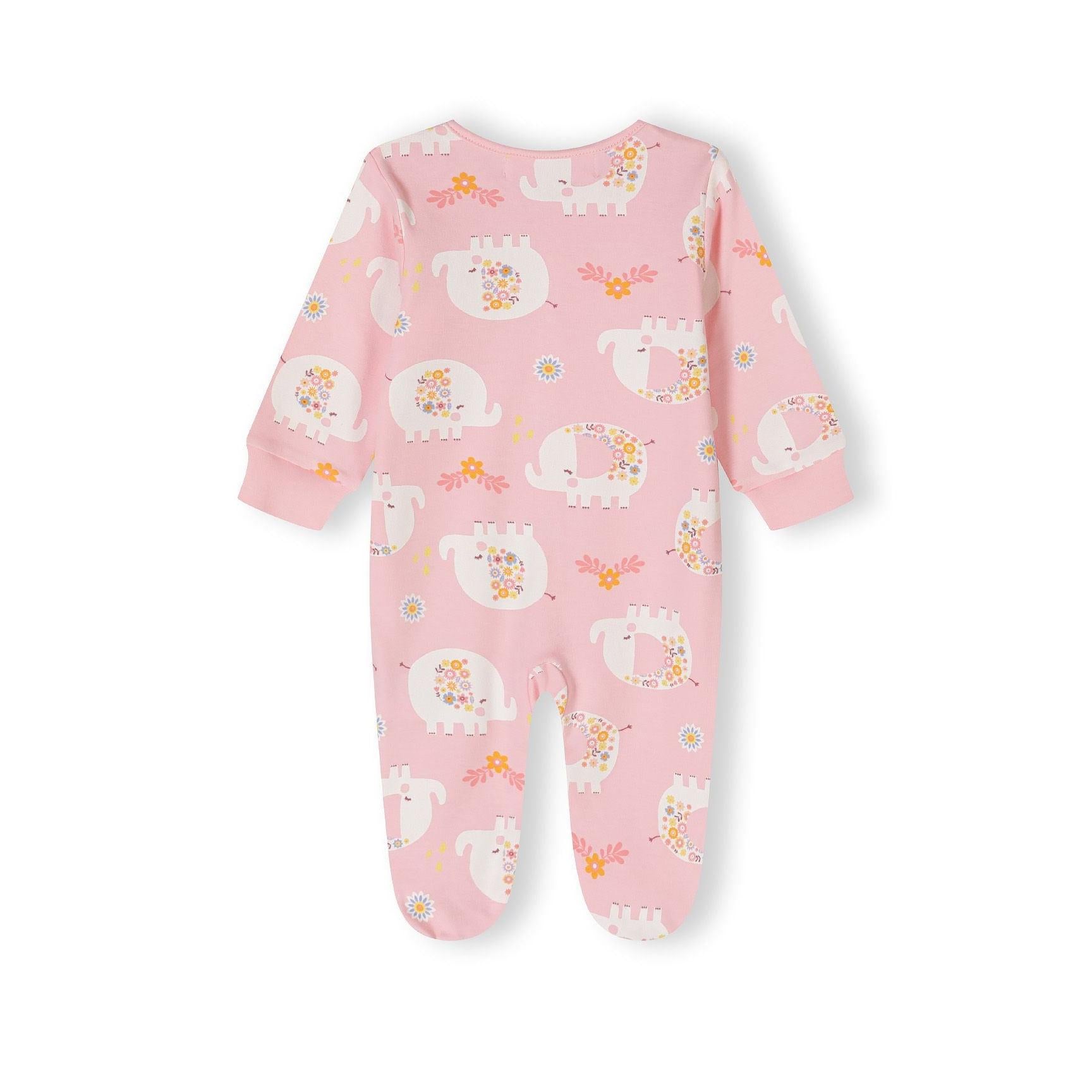 Detail view of pink sleepsuit showing snap button closure, small white elephant design with colourful flowers and Minoti label