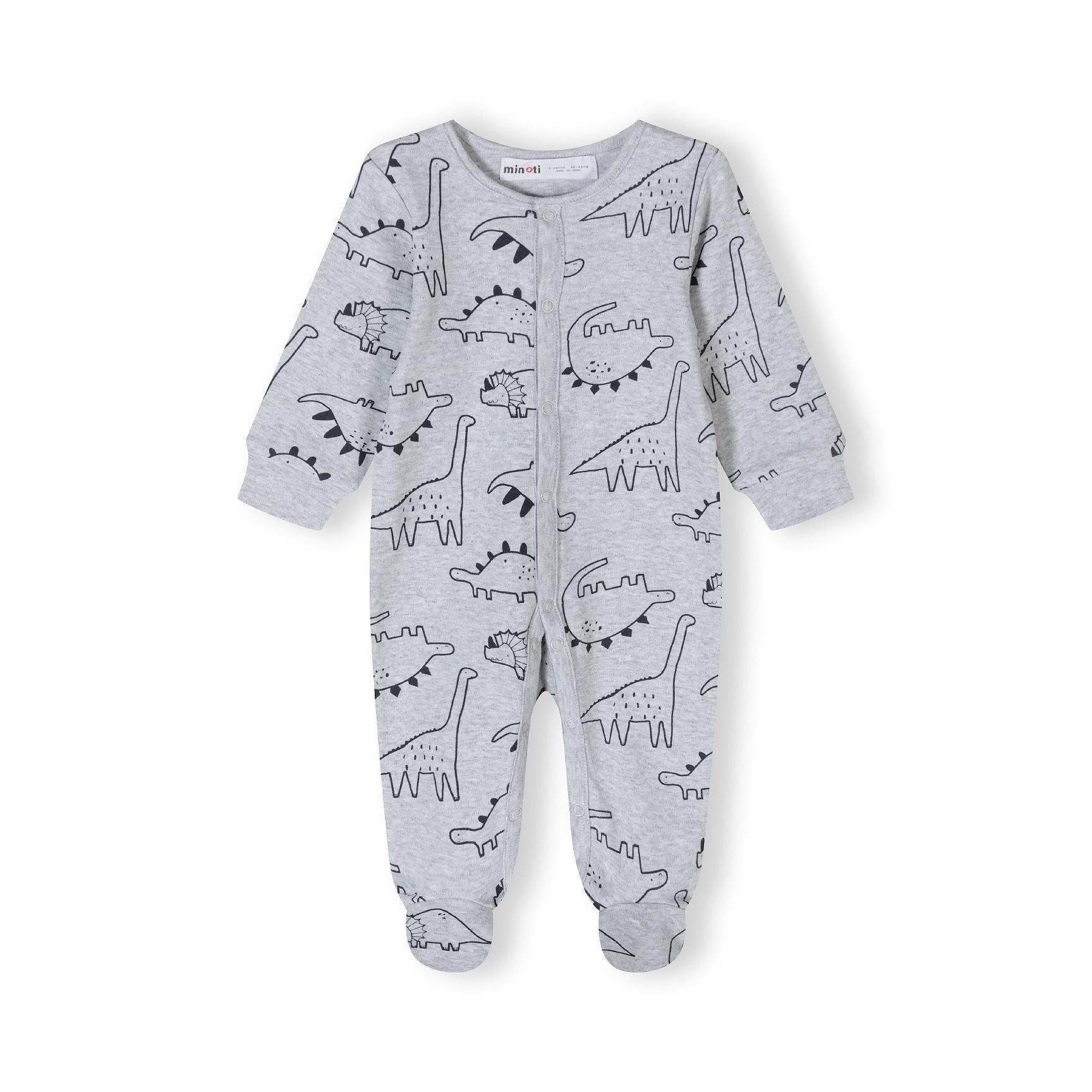 Close-up detail of mint green sleepsuit showing black outlined dinosaur prints and snap button fastenings with Minoti label