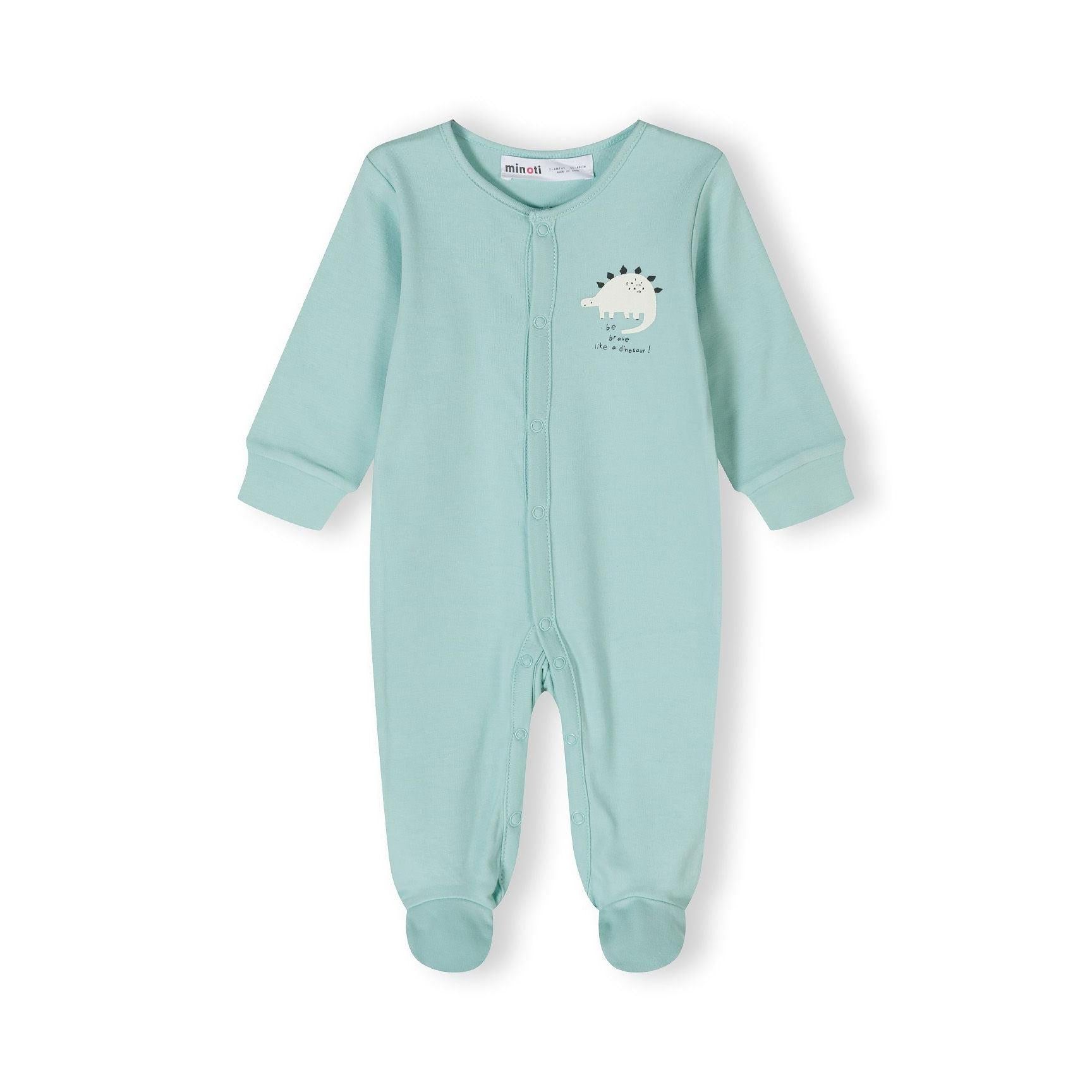 Close-up detail of mint green sleepsuit showing black outlined dinosaur prints and snap button fastenings with Minoti label