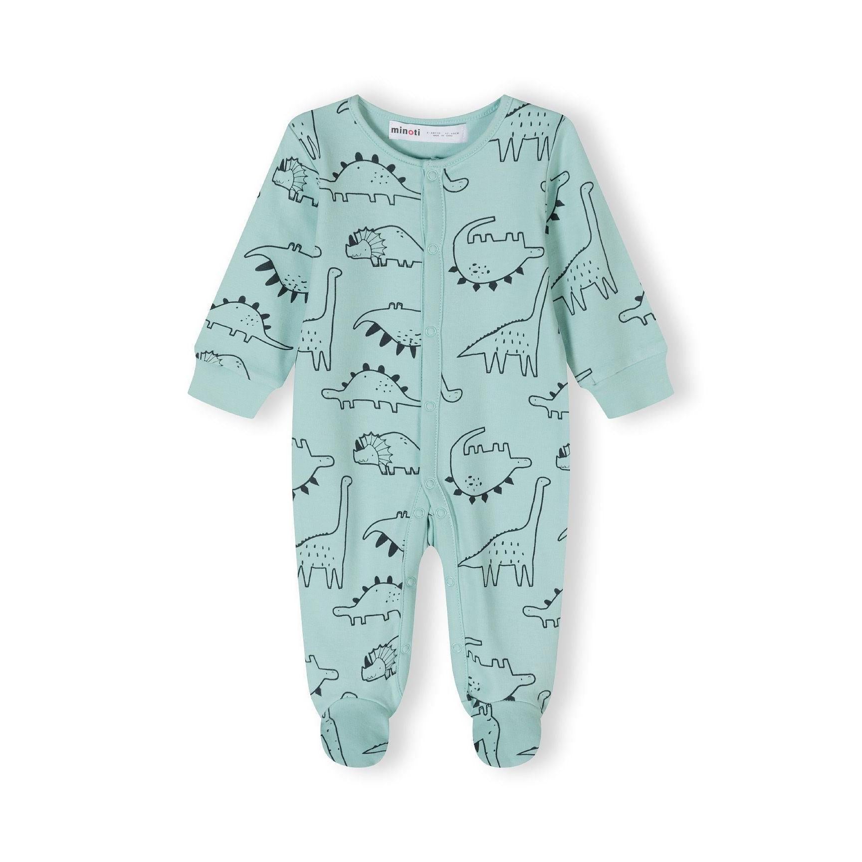 Close-up detail of mint green sleepsuit showing black outlined dinosaur prints and snap button fastenings with Minoti label