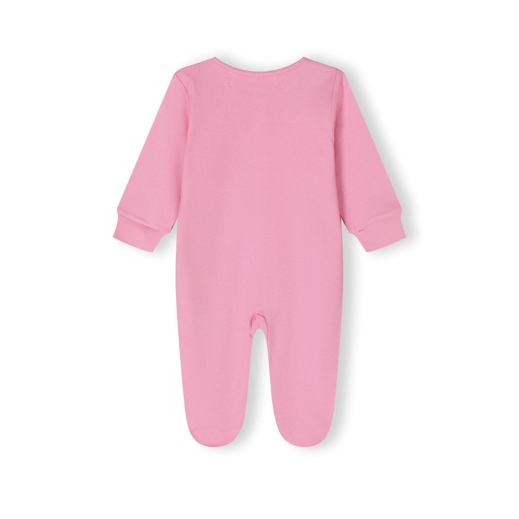 Close-up detail of pink sleepsuit showing lion applique and snap buttons