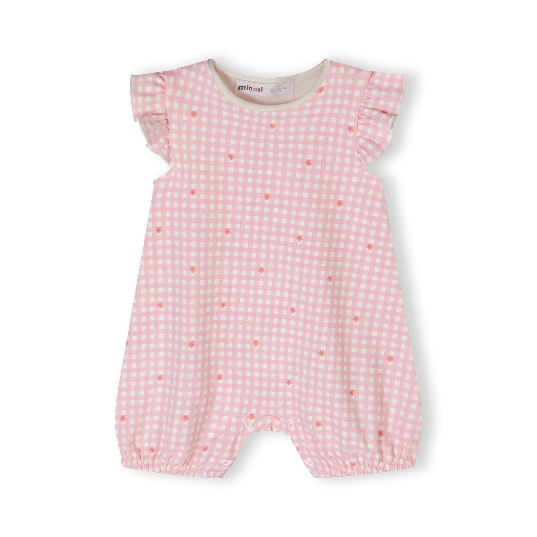 Close-up of light blue romper with white elephant pattern featuring colorful floral designs on elephant bodies, displayed on white background