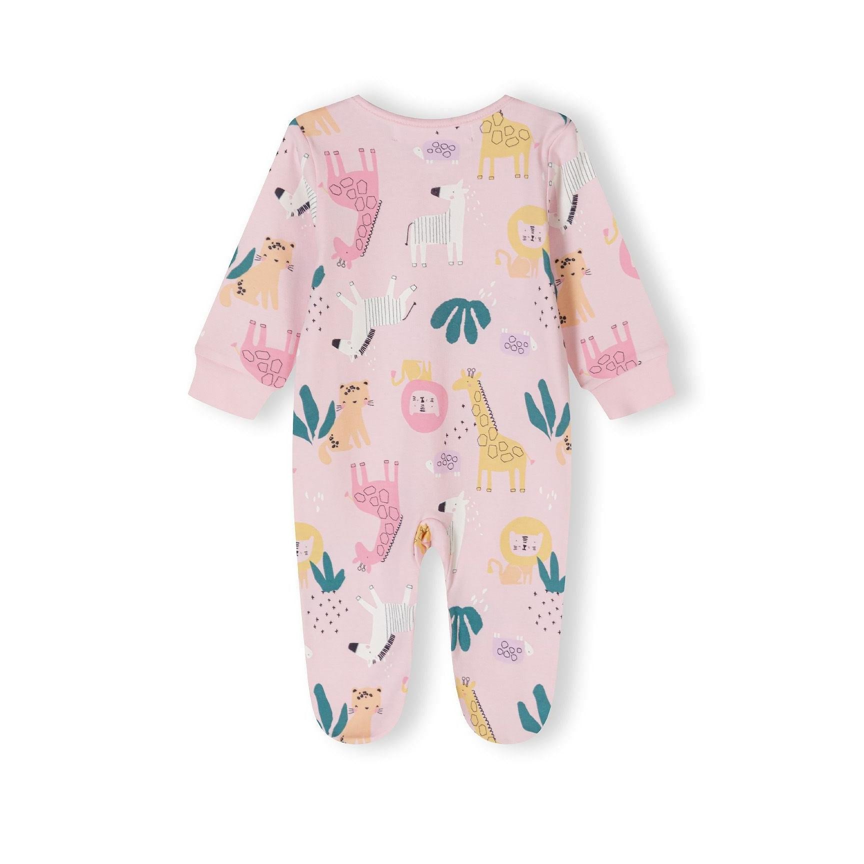 Close-up detail of pink sleepsuit showing snap button closure, Minoti label and jungle animal print with giraffe and leaf motifs