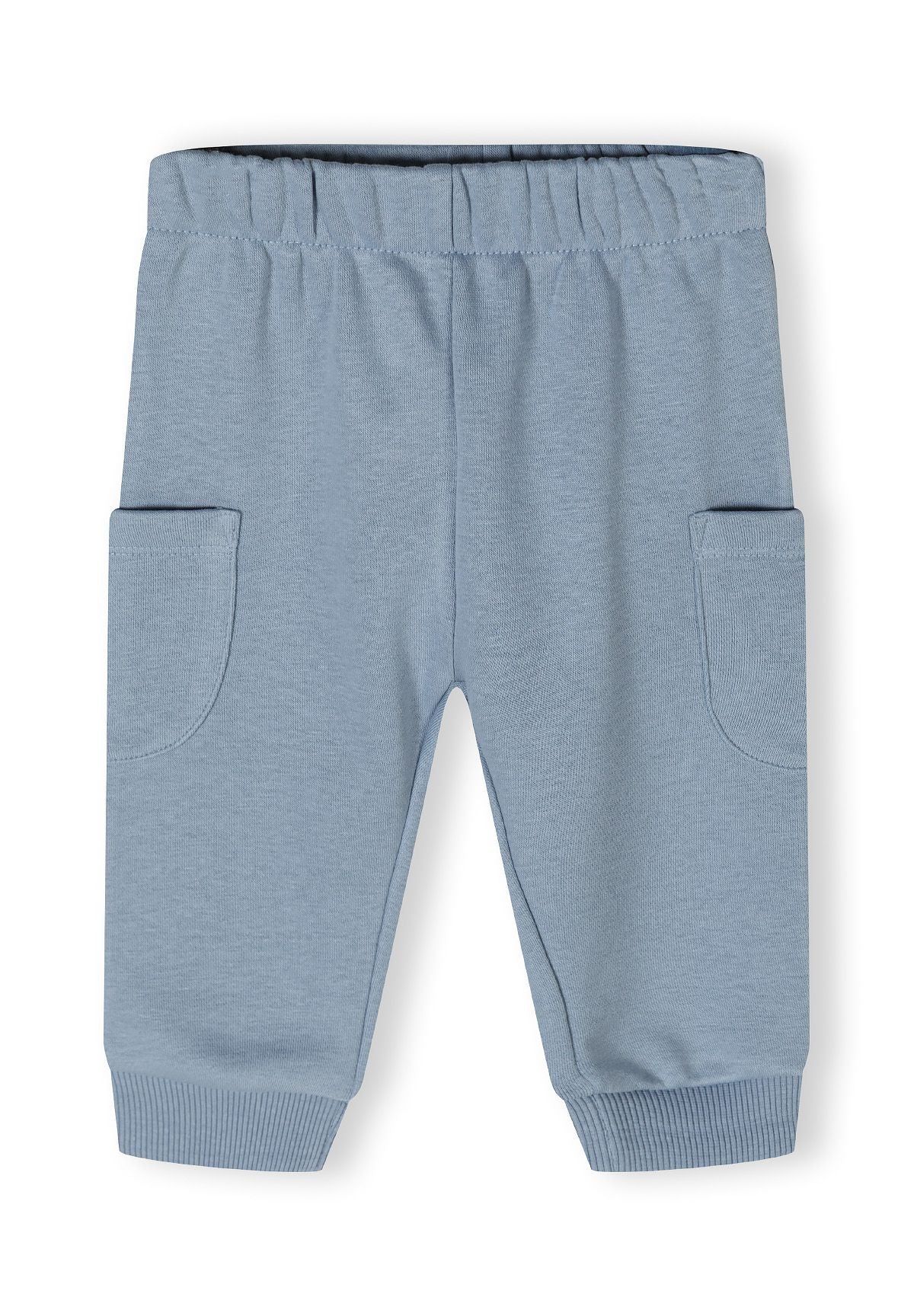 Detail of blue jogger trousers with elasticated waistband and side pockets.