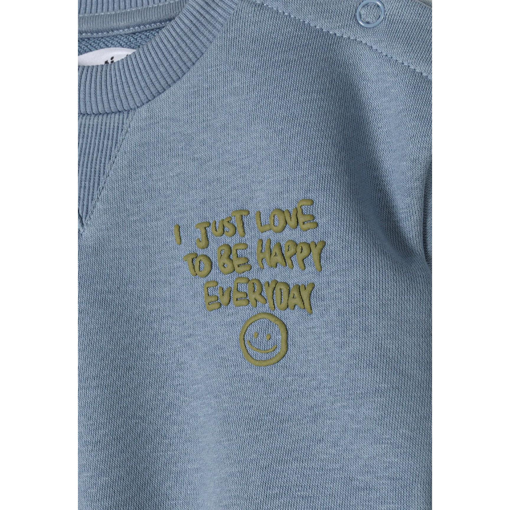 Detailed view of blue joggers pocket construction and fabric texture showing soft cotton material