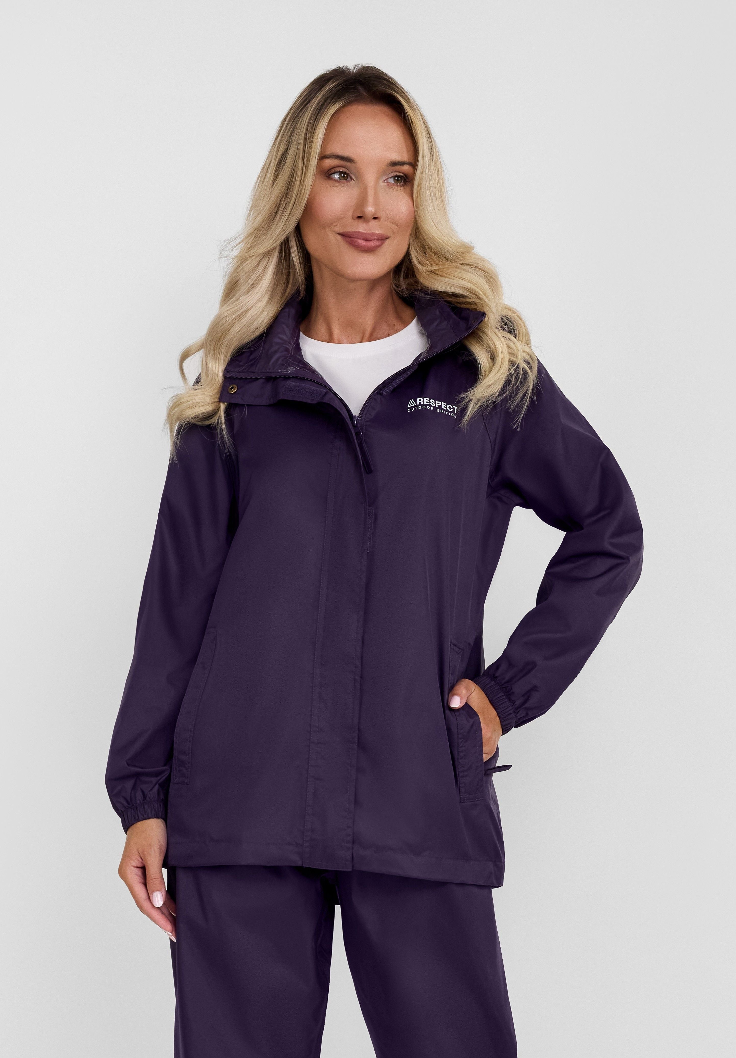 Front view of a women's purple packaway waterproof jacket with a hood and zipped pockets.
